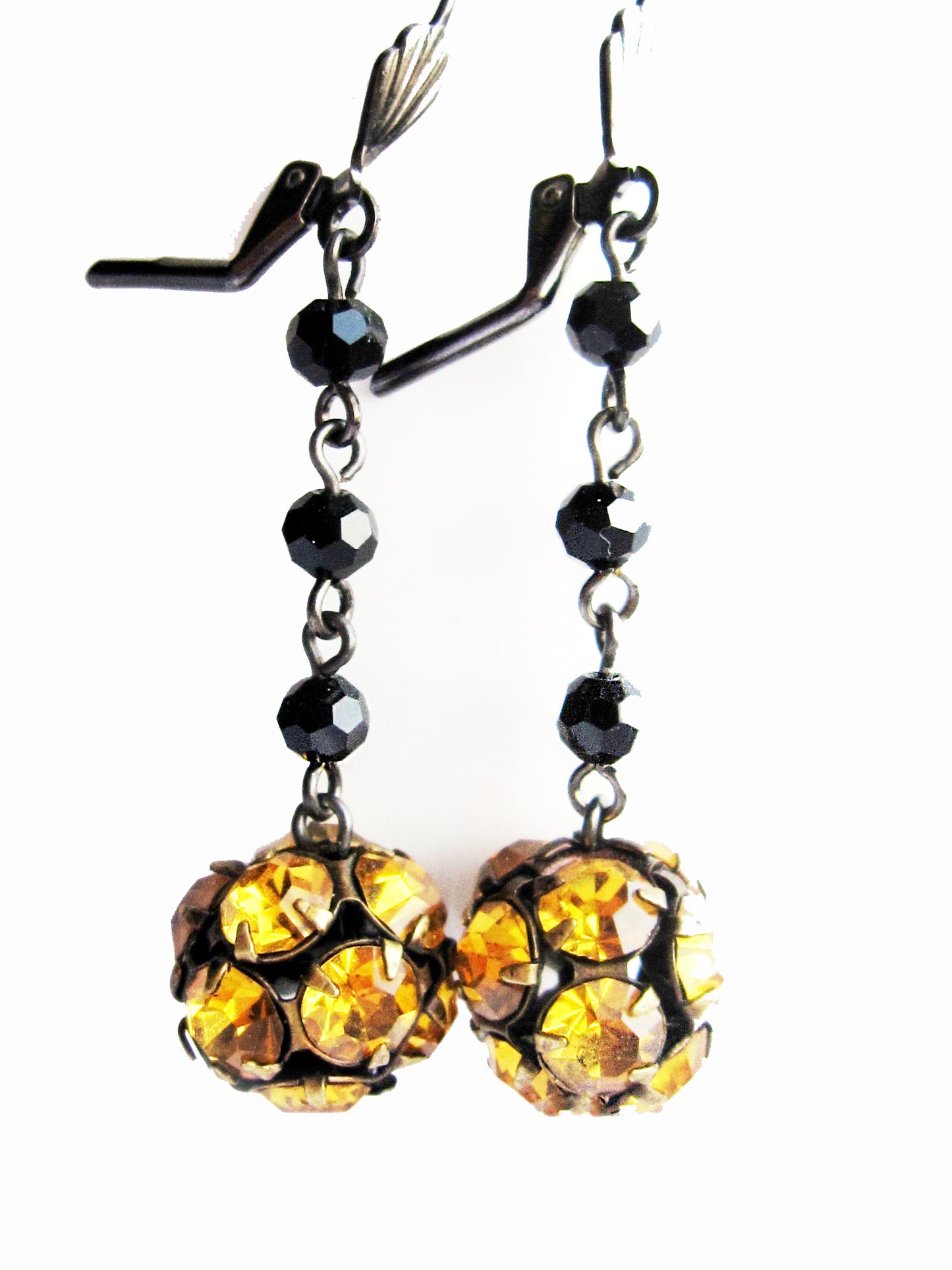 Long Art Deco Black Amber Crystal Earrings dangling on white background