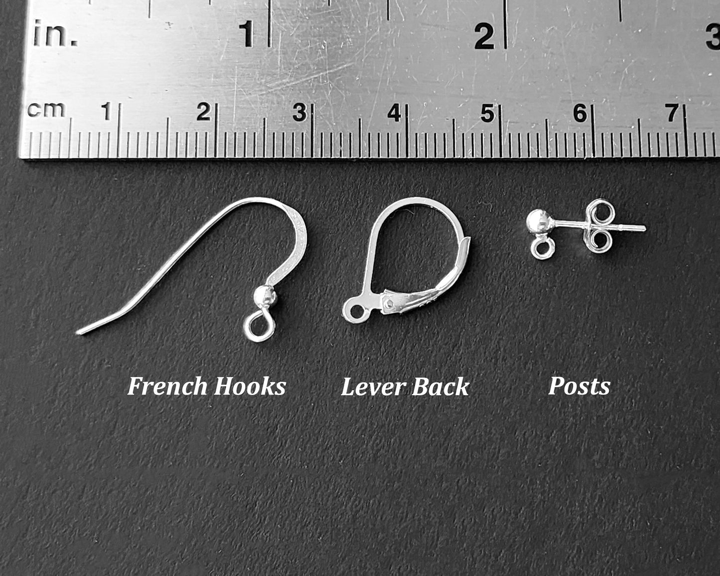 Earring Wire Styles-French-Sheppard Hook-Lever Back-Posts displayed on black with a ruler 