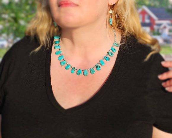 Turquoise Beaded Collar Necklace with blue Turquoise Drop Shaped Stones, sparkly silver Hematite beads and tiny glass seed beads, worn by woman blond hair