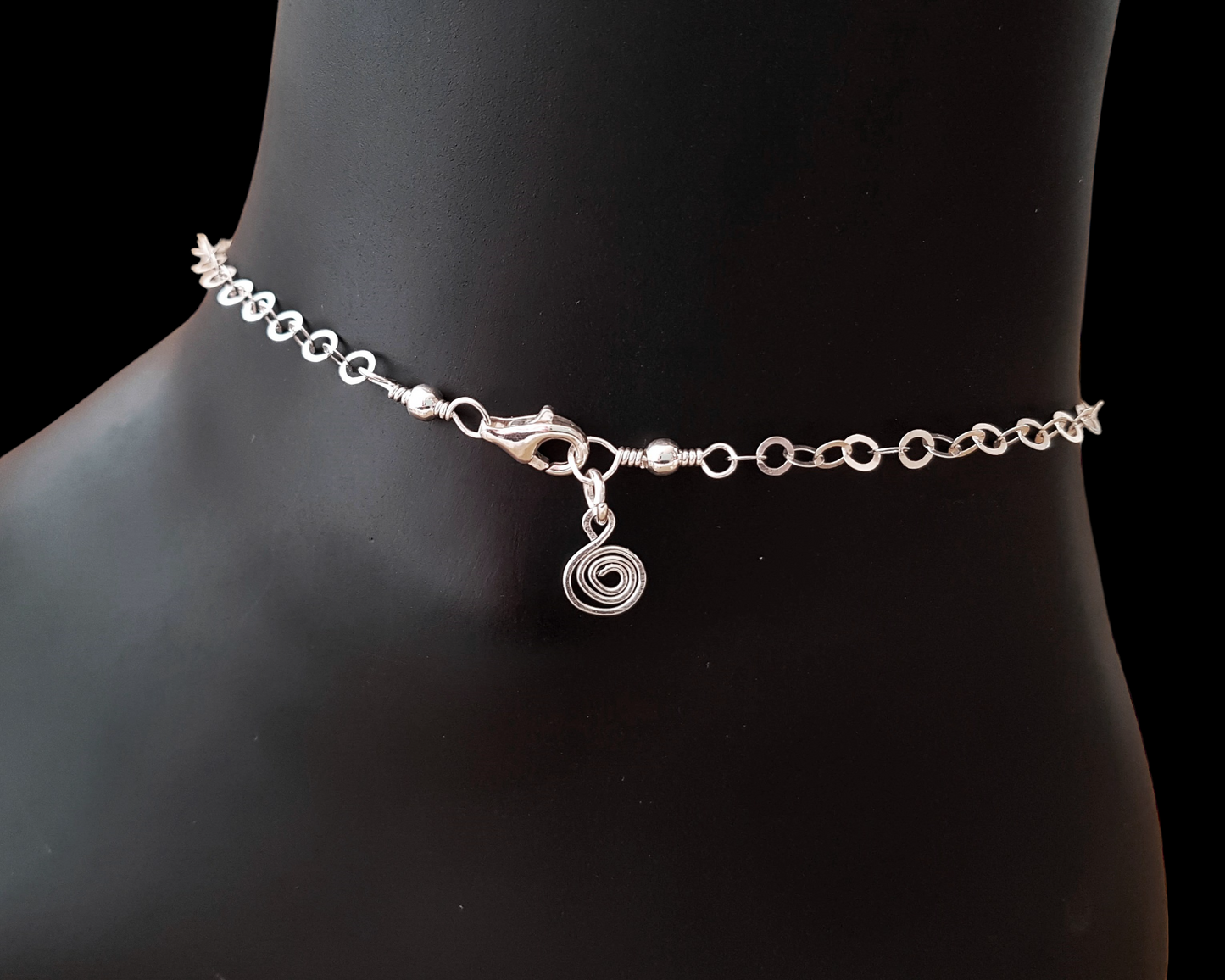 Ankle Bracelet end with sparkly flat rolo style chain, lobster claw clasp, wire wrapped loops and Celtic Eternity Coil pendant dangling on the end.