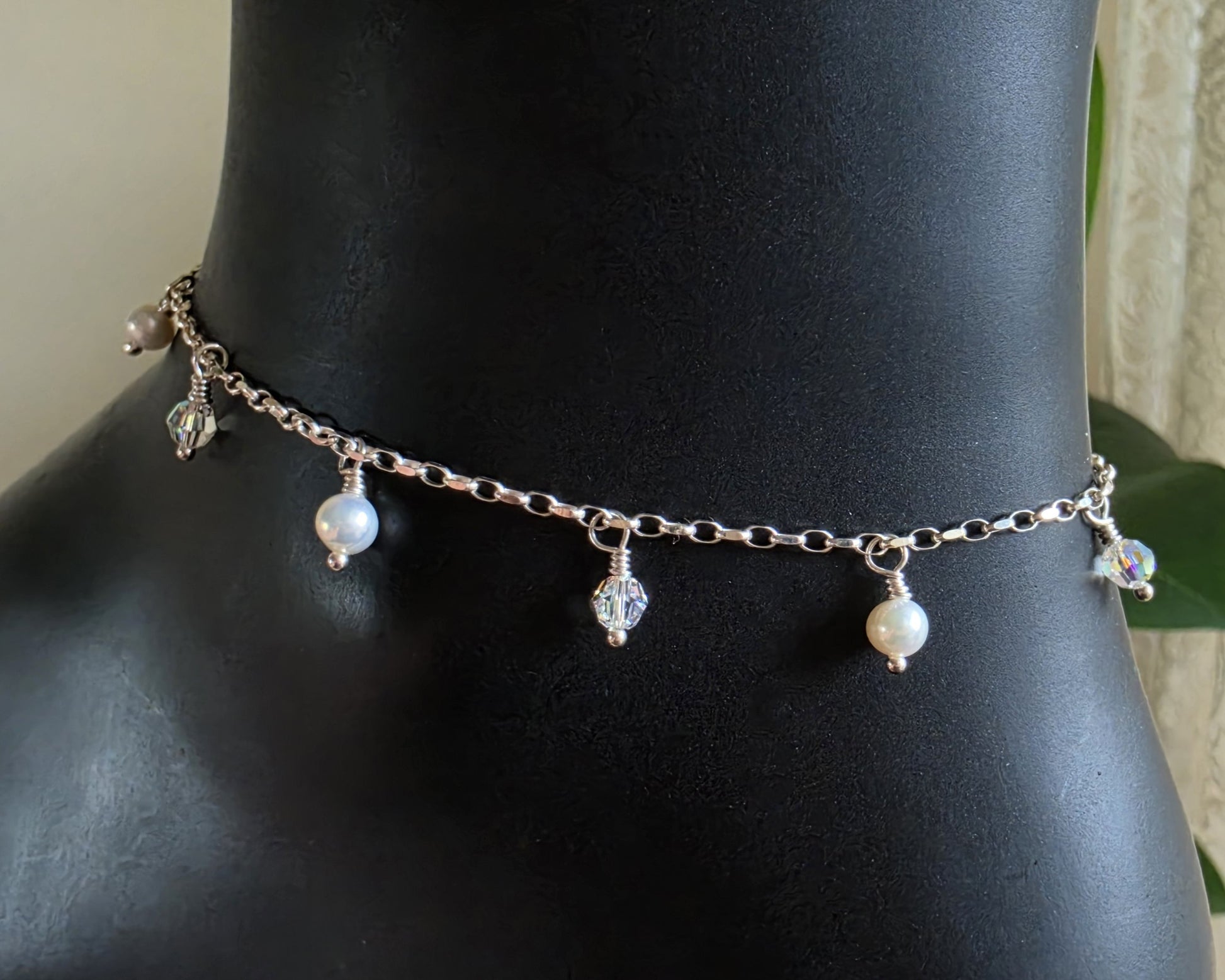 Silver Anklet Ankle Bracelet with small white Freshwater Cultured Pearls and Crystal Dangles from on chain displayed on black ankle