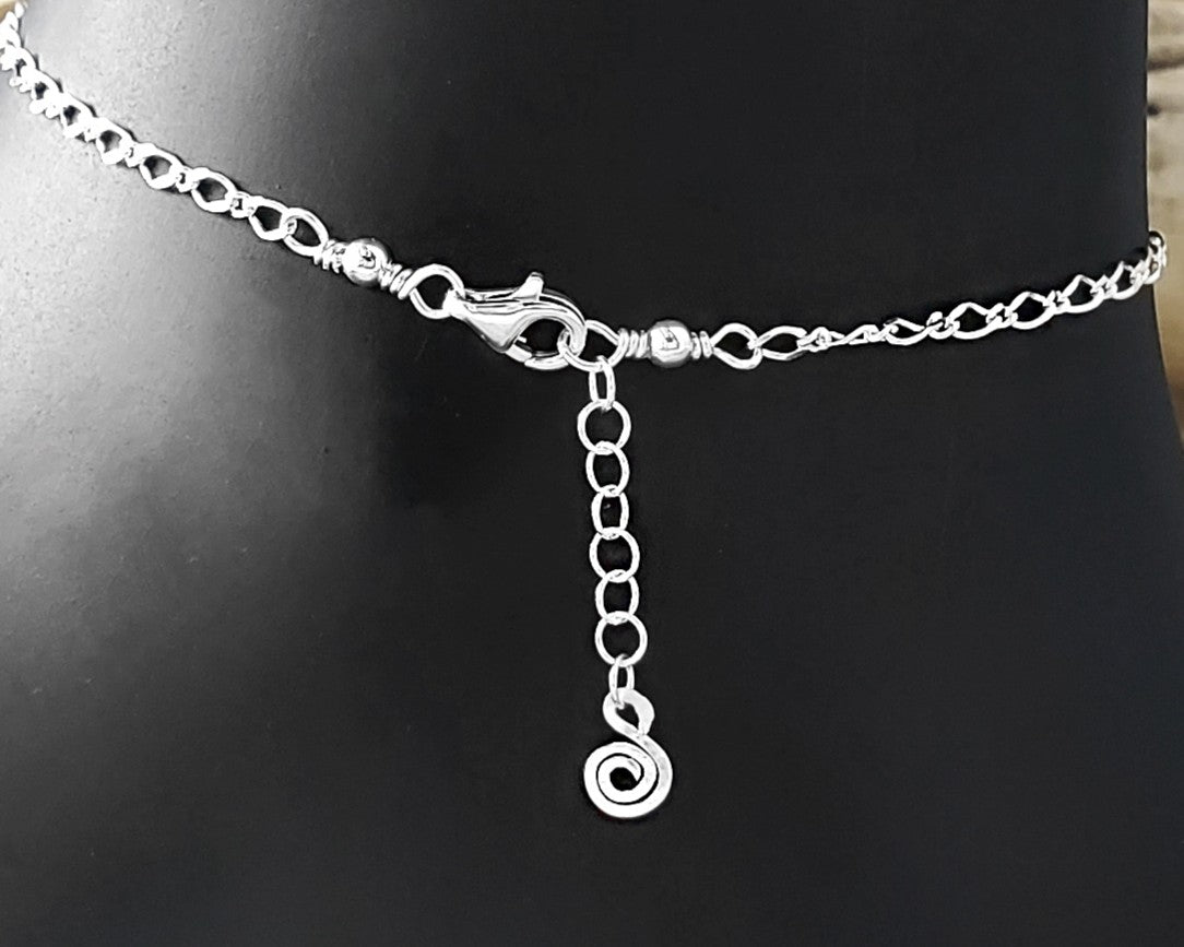 -Silver Chain Anklet with Lobster Claw Clasp, Eternity Coil pendant on Extension chain on black background 