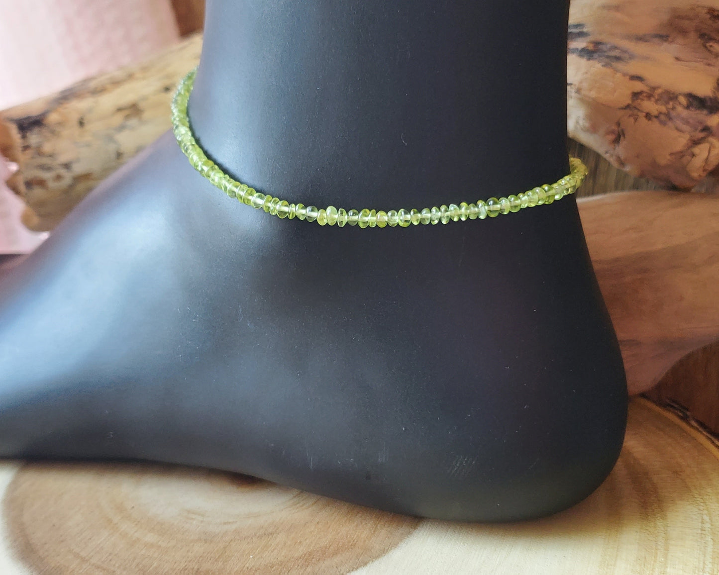 Peridot Beaded Ankle Bracelet, Anklet with Green Gemstones and Sterling Silver on Black display