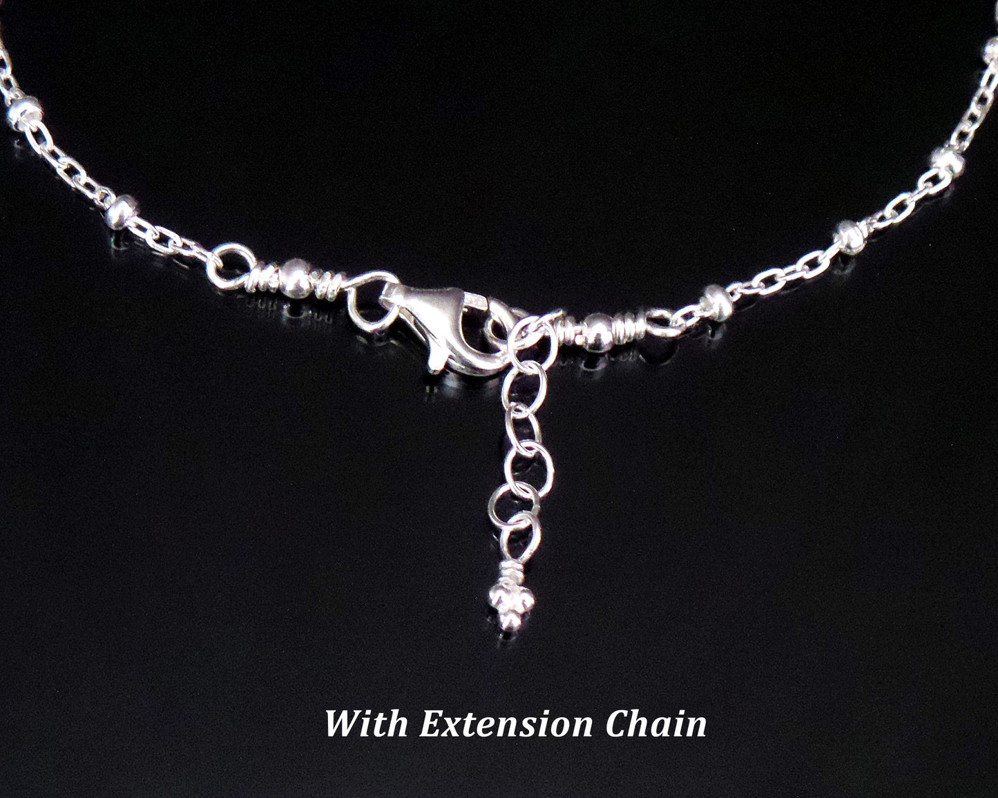 Satellite Chain, Lobster Claw Clasp and Extension chain on black background