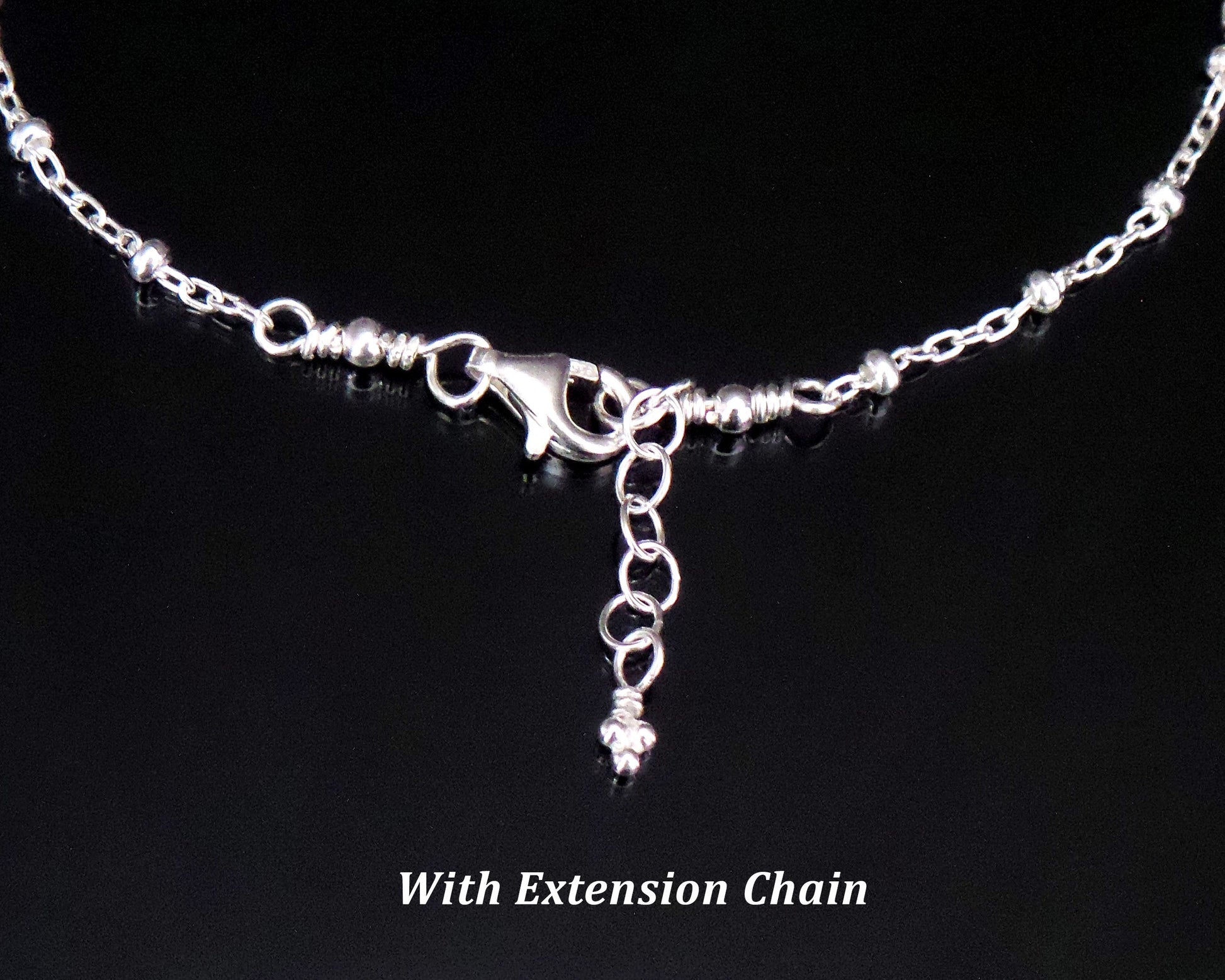 Satellite Chain, Lobster Claw Clasp and Extension chain on black background