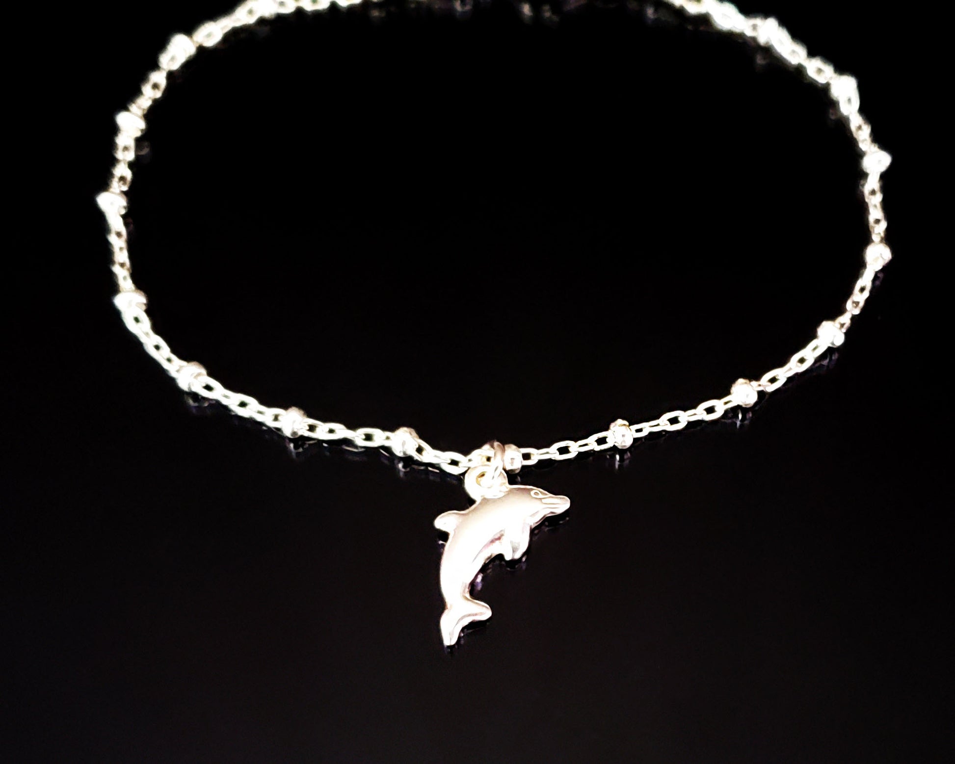 Silver Dolphin Anklet, Ankle Bracelet with Dolphin Pendant on Satellite Chain on black background