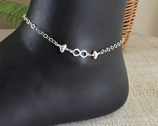 Silver Anklet with infinity pendant and two hearts on either side on chain 