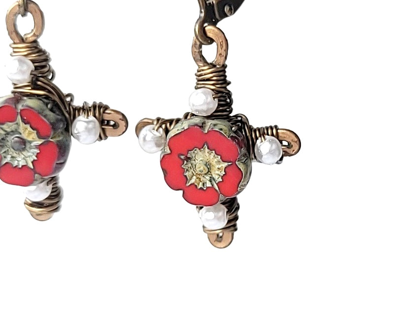 Antique Style Red Flower Cross, Vintage Inspired Cross Earrings with red flowers in the centre and tiny white pearls on the four points of the cross made with antiqued brass metal.