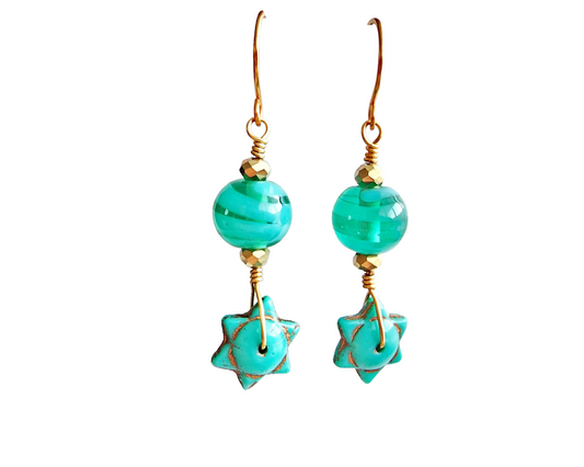 Handmade Turquoise Star beaded Wire Wrapped long dangle earring with gold wire and sparkly gold beads on french hooks with white background 