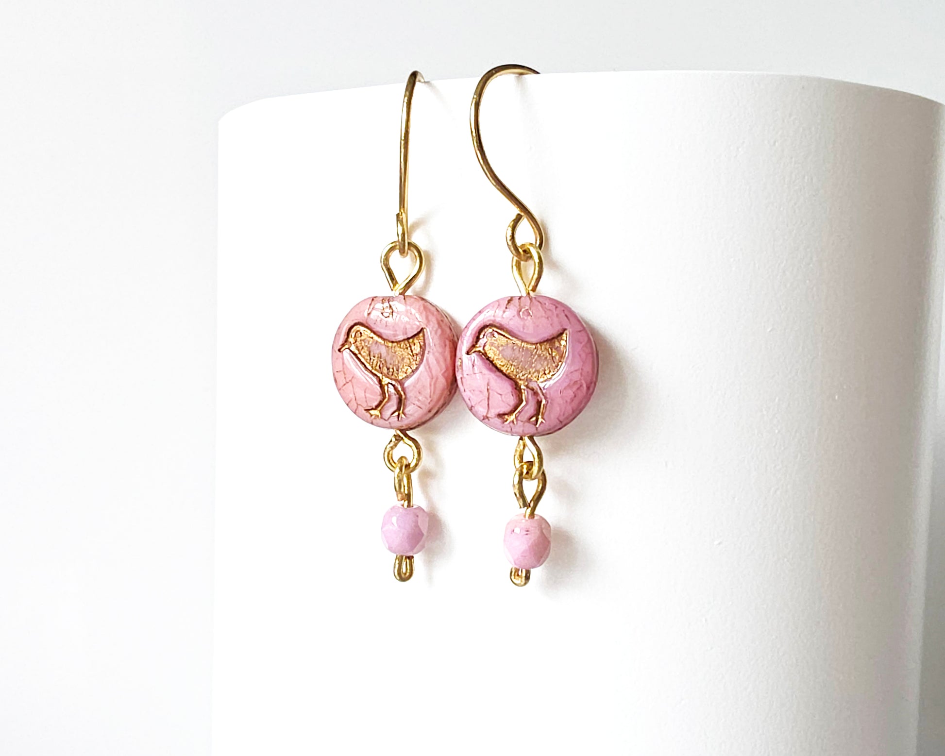 Rose Pink Gold Dangle Earrings with Sparrow Bird on white  background 
