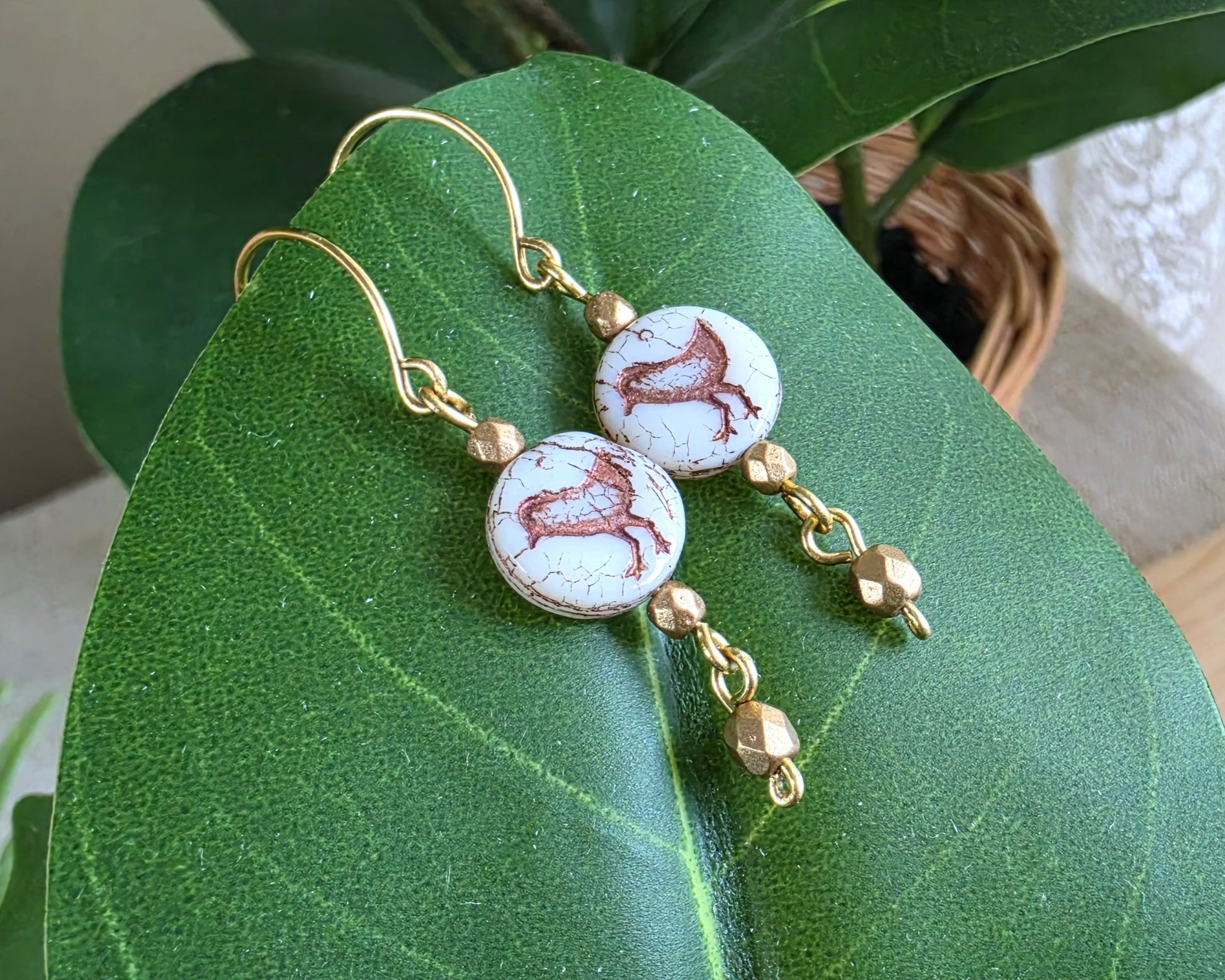 White and gold Sparrow Bird Dangle beaded Earrings on leaf.