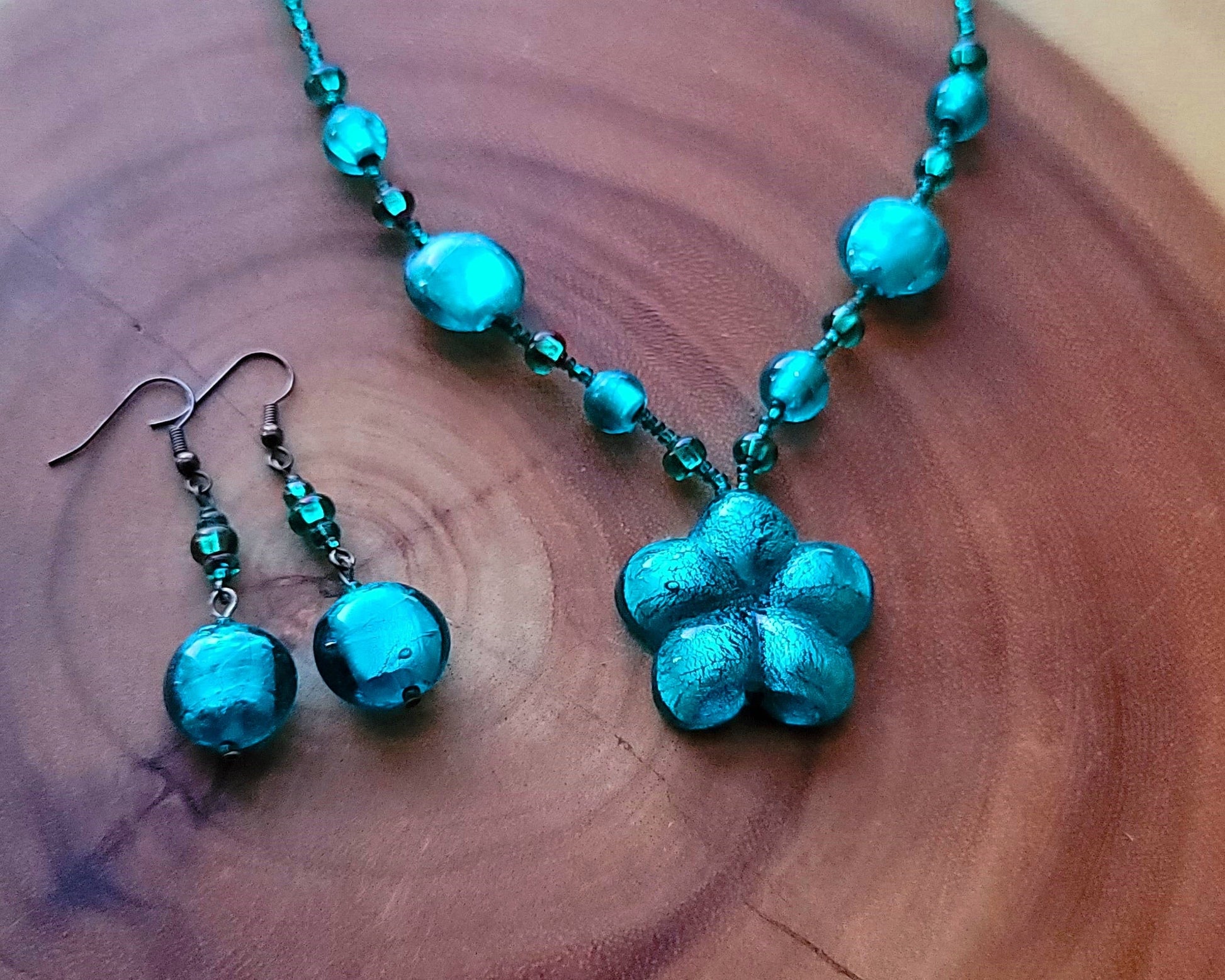 Luminous Teal Flower Necklace and Dangle Earring Set, a beaded teal, blue foil glass flower Necklace and Earrings