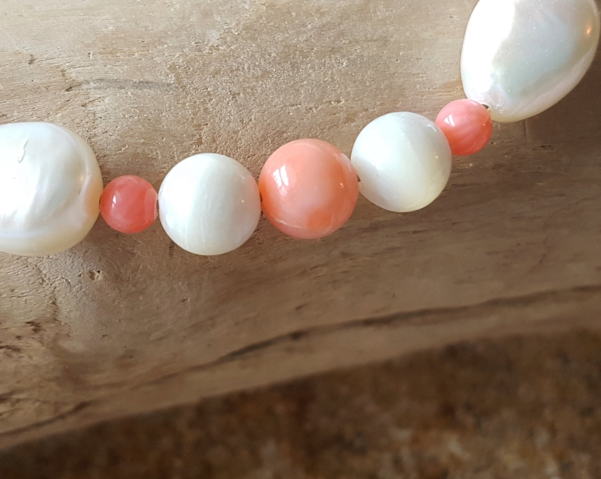 Angle Skin Coral, Mother of Pearl, Freshwater Cultured Pearl Beaded Bracelet. Pale orange Coral, white Mother of Pearl, white Pearls. 