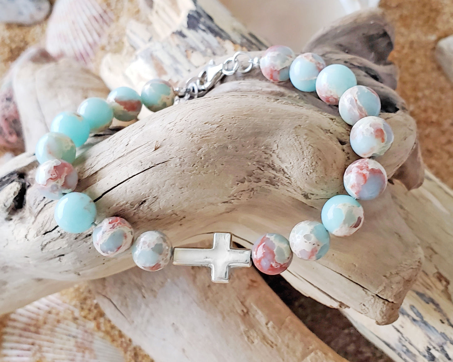 Sideways Cross and Aqua blue Sea Sediment Jasper Beaded Bracelet. Sterling Silver, Lobster Claw Clasp and Extension chain. 