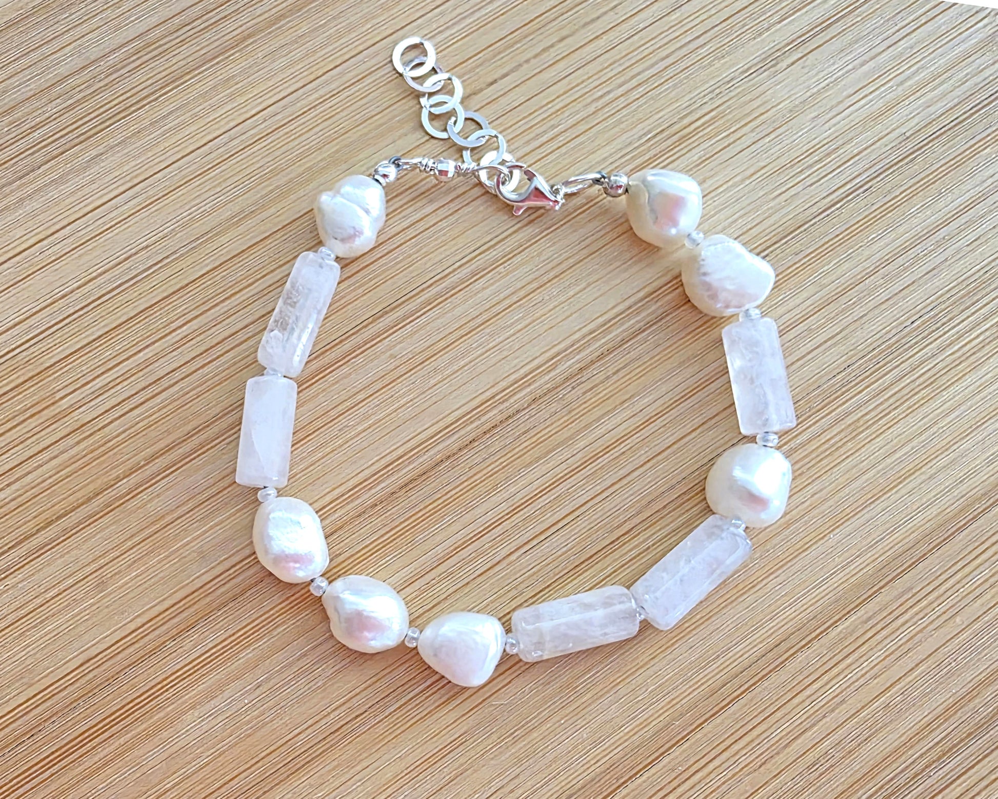 Rose Quartz & Freshwater Cultured Pearl PEACE bracelet, Morse Code spells PEACE with Pale Pink stones white Pearls & 925 Sterling Silver on wood