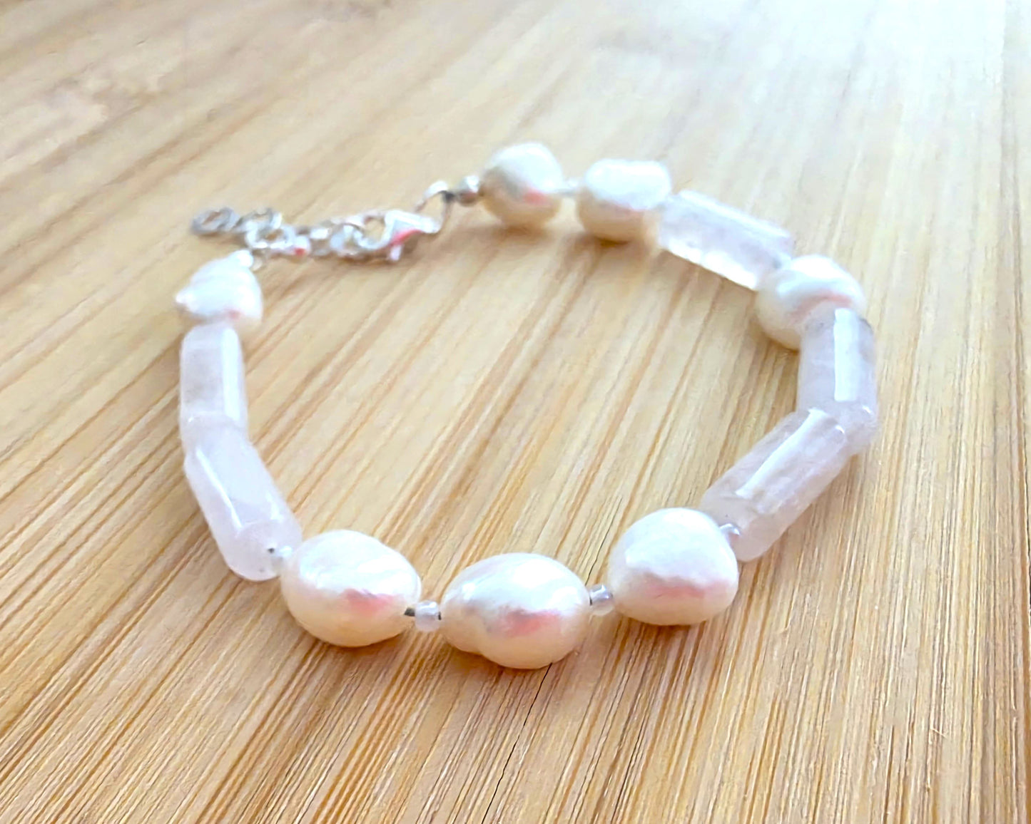 Rose Quartz & Freshwater Cultured Pearl PEACE bracelet, Morse Code spells PEACE with Pale Pink stones white Pearls & 925 Sterling Silver on wood