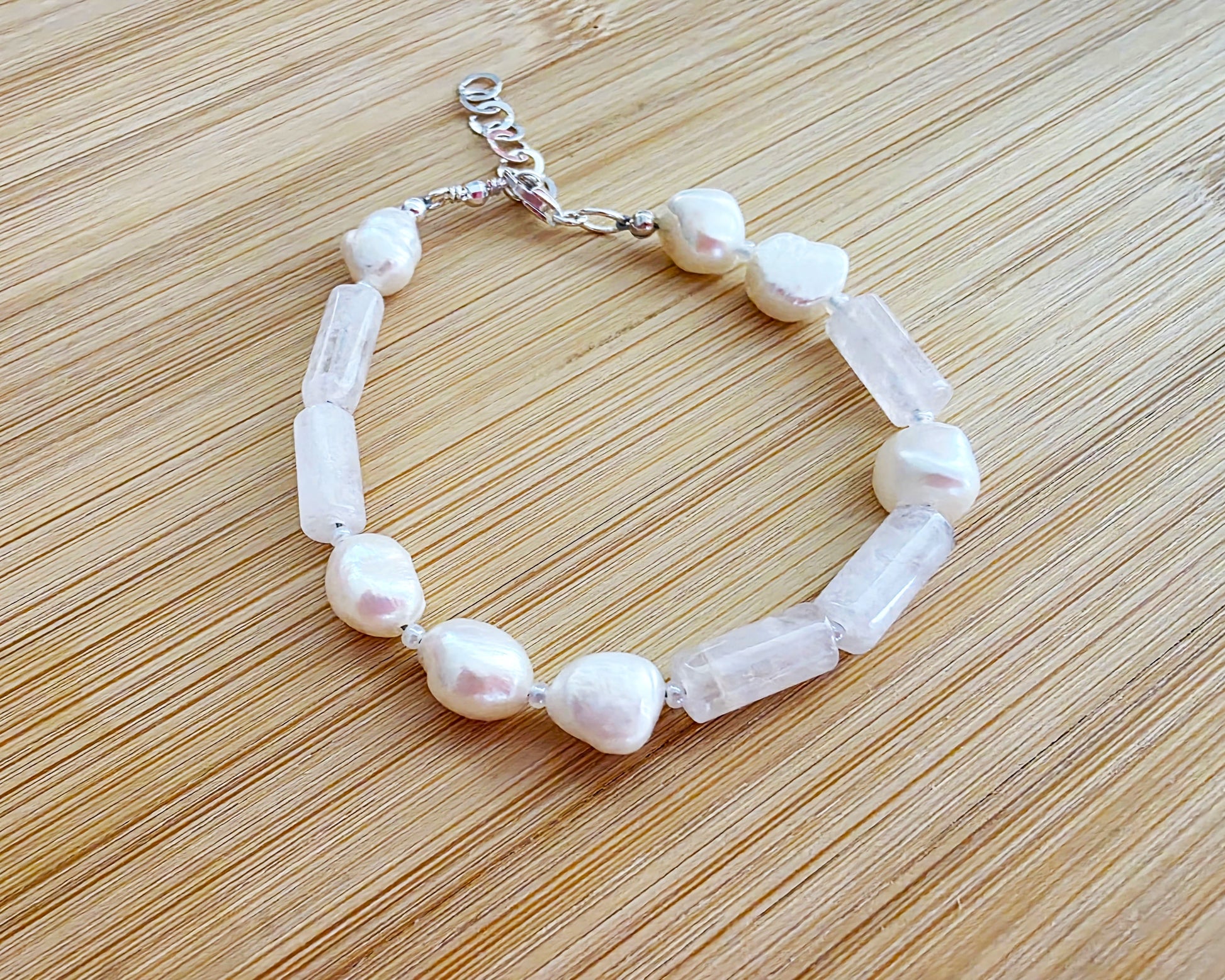 Rose Quartz & Freshwater Cultured Pearl PEACE bracelet, Morse Code spells PEACE with Pale Pink stones white Pearls & 925 Sterling Silver on wood