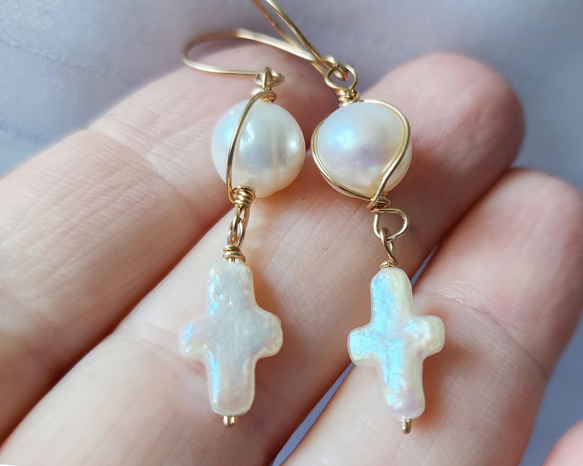 Long Freshwater Cultured Pearl Cross Dangle Earrings with a round pearl on top and Cross dangling below, wrapped with 14k Gold Filled wire and French earrings hooks. 