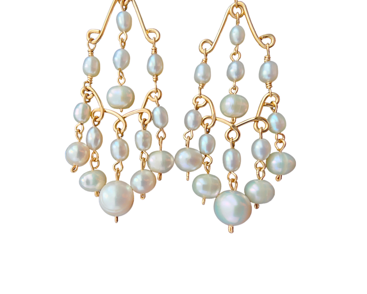 A pair of Long bohemian style elaborate pearl chandelier earrings, 14k Gold Filled and white Freshwater Cultured Pearls on white background 