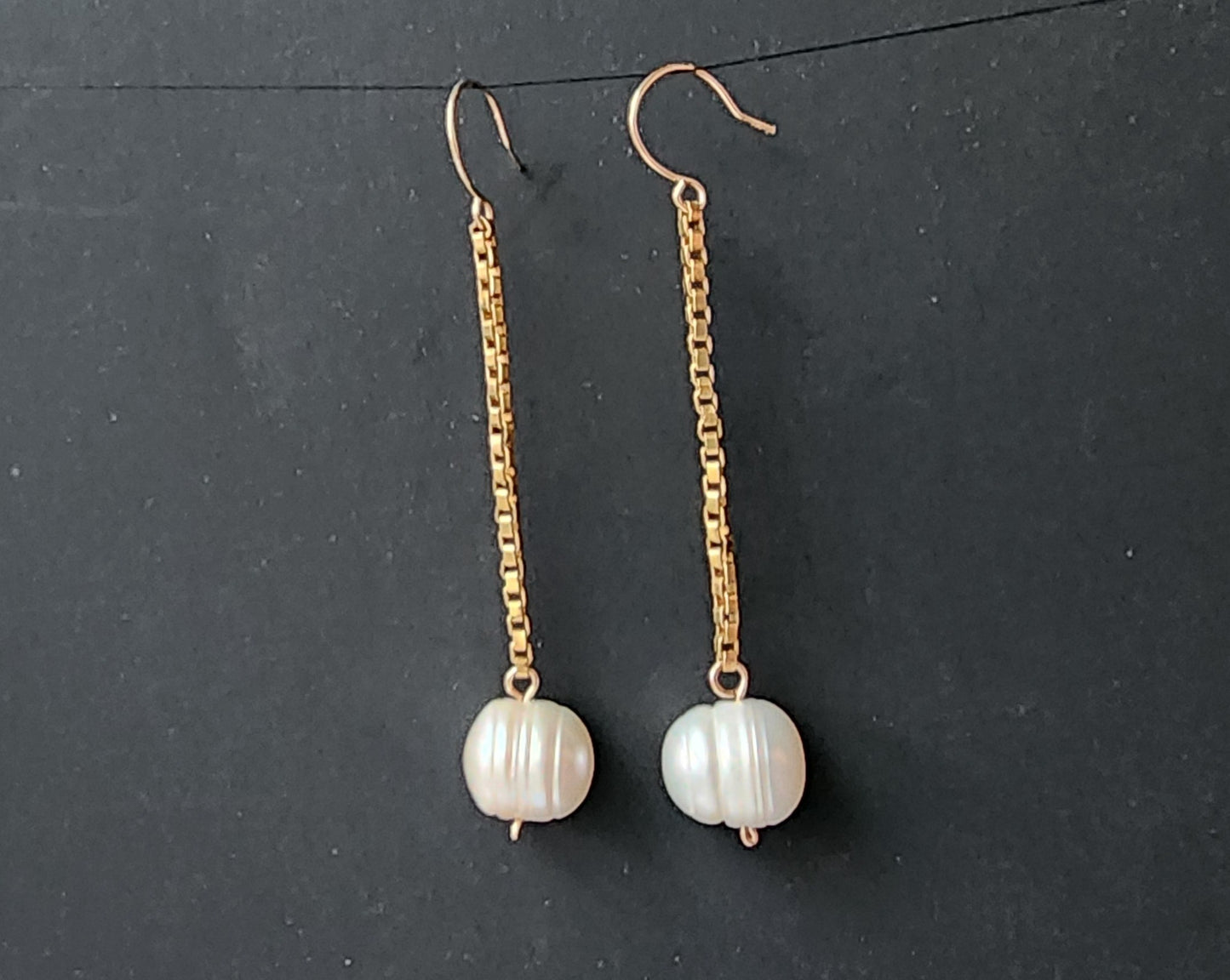 Extra-long Pearl dangle earrings with large white Freshwater Cultured Pearls dangle from 14k Gold Filled box style chain. Earring have french style earring hooks. 