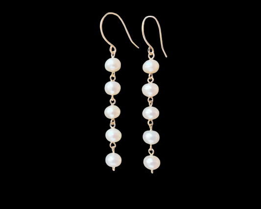 Long white pearl Dangle earrings with five round  Freshwater Cultured Pearls and 14k gold filled metal, dangling from French style earring wires. 