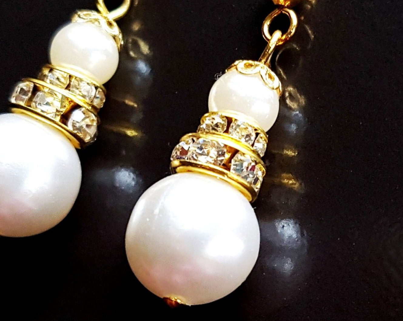 Victorian Style Large Pearl and Crystal Earrings, long dangles earring with large white peals and decorative gold details and crystal. Earrings dangle on french style earring hooks 