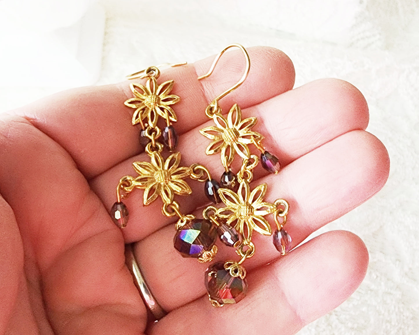 Long Gold Floral Crystal Chandelier Earrings, Long gold flowers with mauve AB crystal dangles on white 