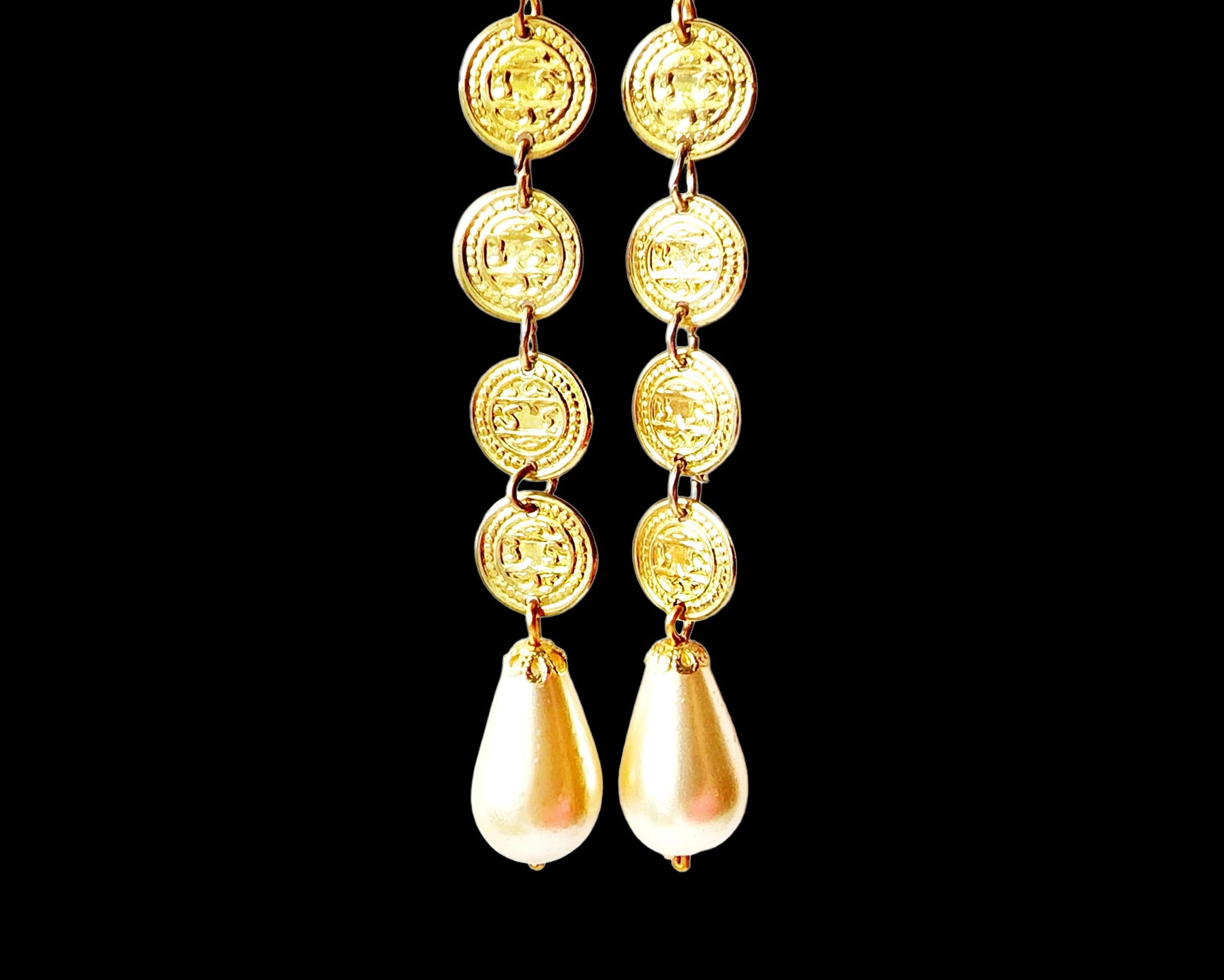 Boho Chic Long Coin Pearl Earrings, large white drop shaped cream color faux pearls dangle beneath a stream of four gold coils. 