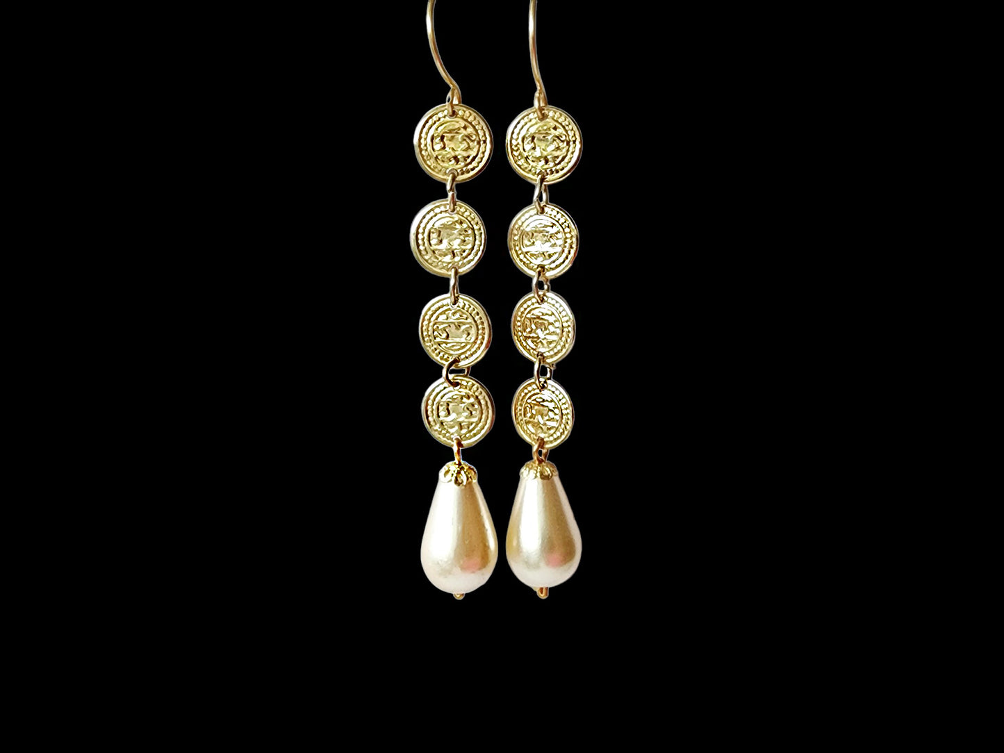 Boho Chic Long Coin Pearl Earrings, large white drop shaped cream color faux pearls dangle beneath a stream of four gold coils. 