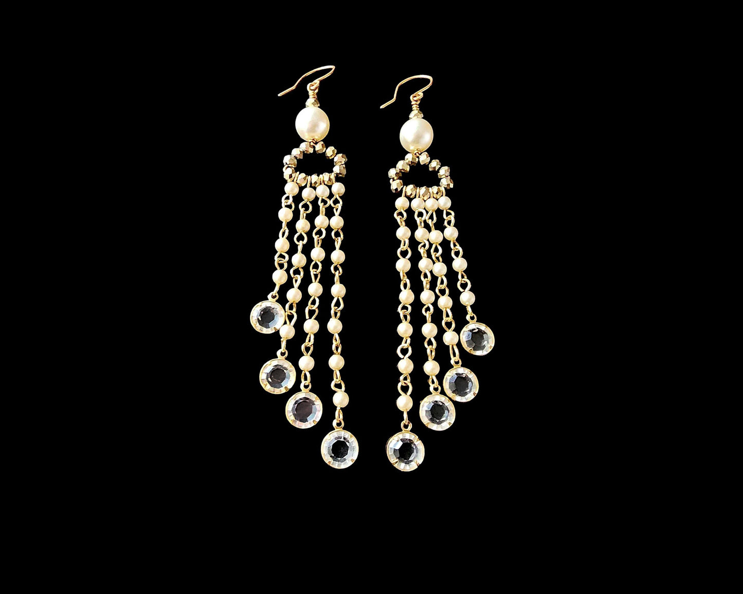 Long Eco Elegance Pearl Crystal Chandelier Tassel Earrings with long streams of tiny white pears and crystal pendants on the base of each strand, dangling from gold crystal and large white pearls. 