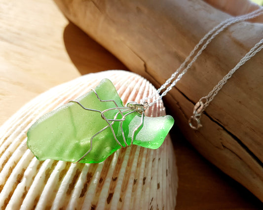 Green Leaf Freshwater Sea Glass / Beach Glass Pendant wire wrapped, dangling on Sterling Silver chain on Shell and wood background