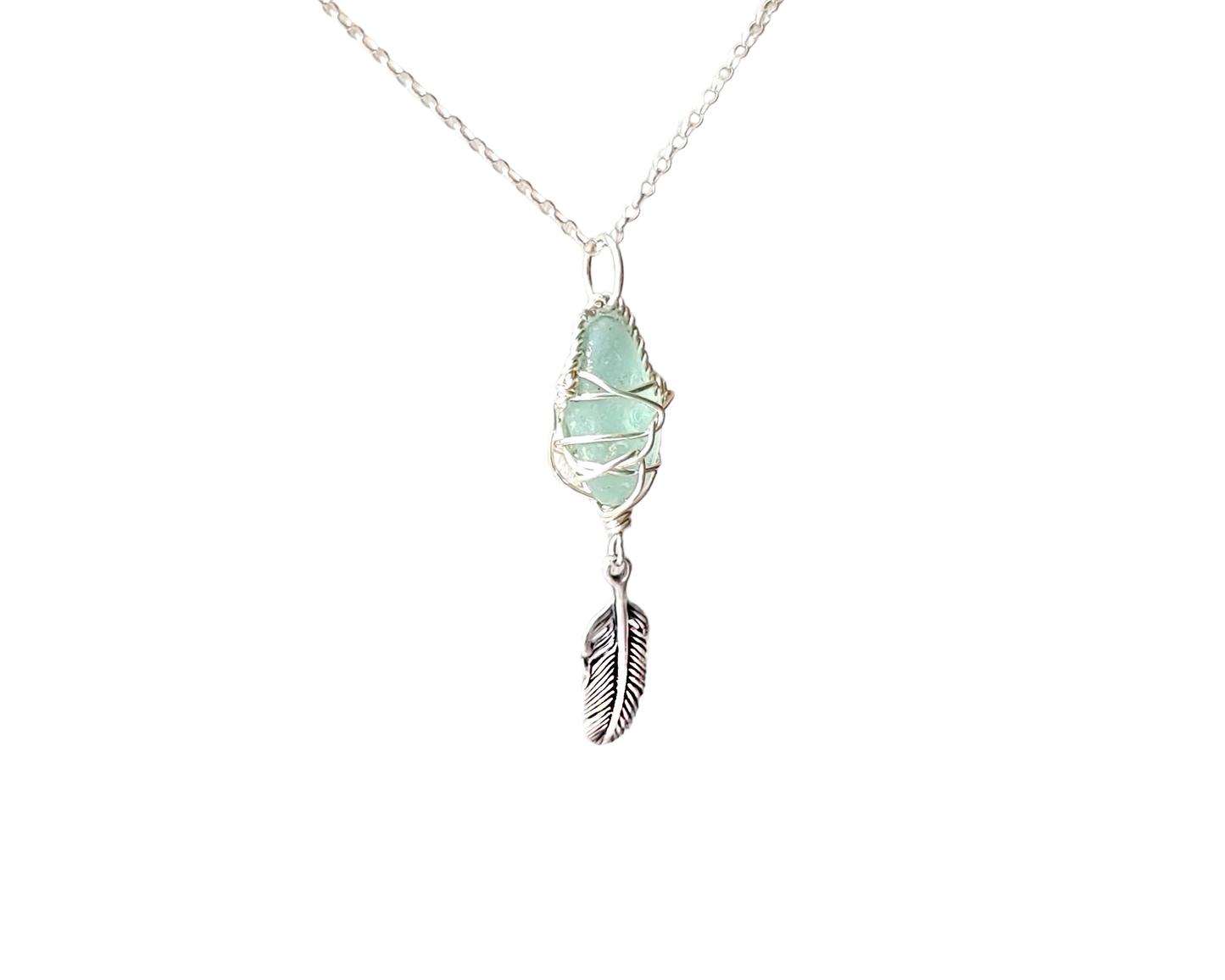 Sterling Silver, Aqua blue Beach Glass (Freshwater Sea Glass) Pendant, Wire Wrapped design with dangling Feather. The pendant dangles in rolo link chain.  