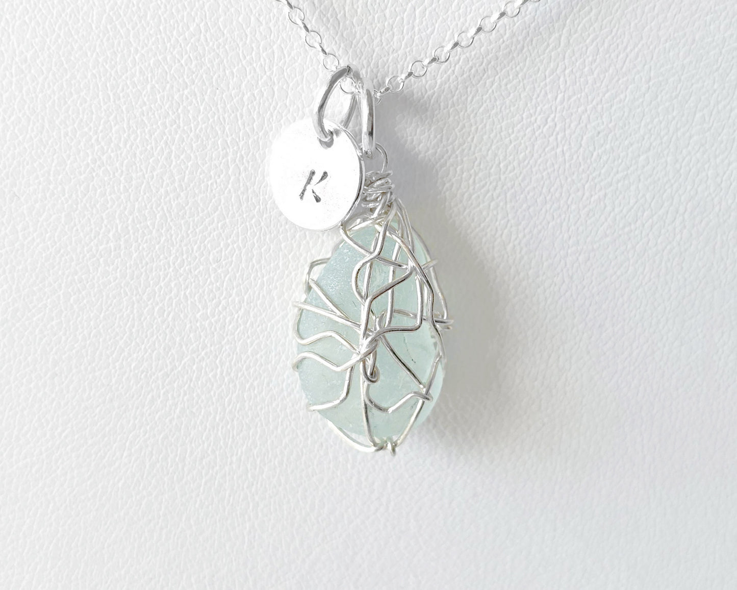 Aqua Blue Sea Glass, Freshwater Sea Glass Wire Wrapped Pendant Necklace with Initial Pendant on Sterling Silver Rolo Chain on white background
