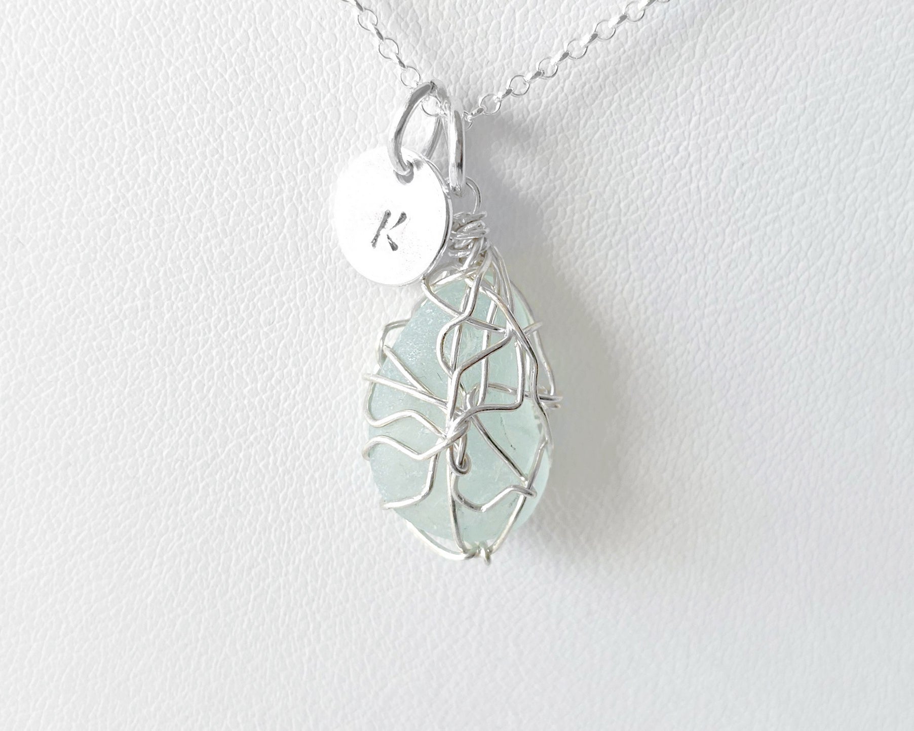 Aqua Blue Sea Glass, Freshwater Sea Glass Wire Wrapped Pendant Necklace with Initial Pendant on Sterling Silver Rolo Chain on white background