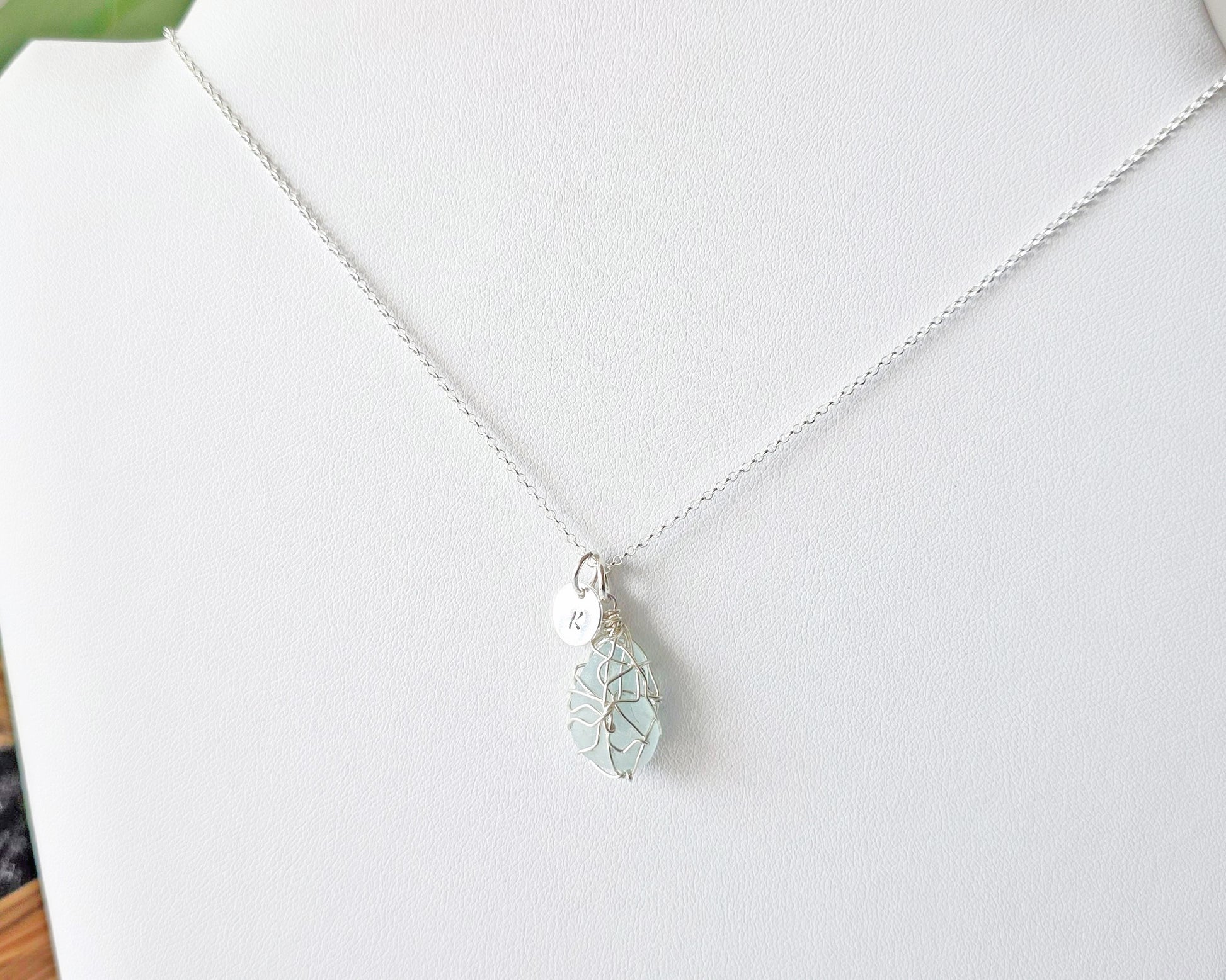 Aqua Blue Sea Glass, Freshwater Sea Glass Wire Wrapped Pendant Necklace with Initial Pendant on Sterling Silver Rolo Chain on white background