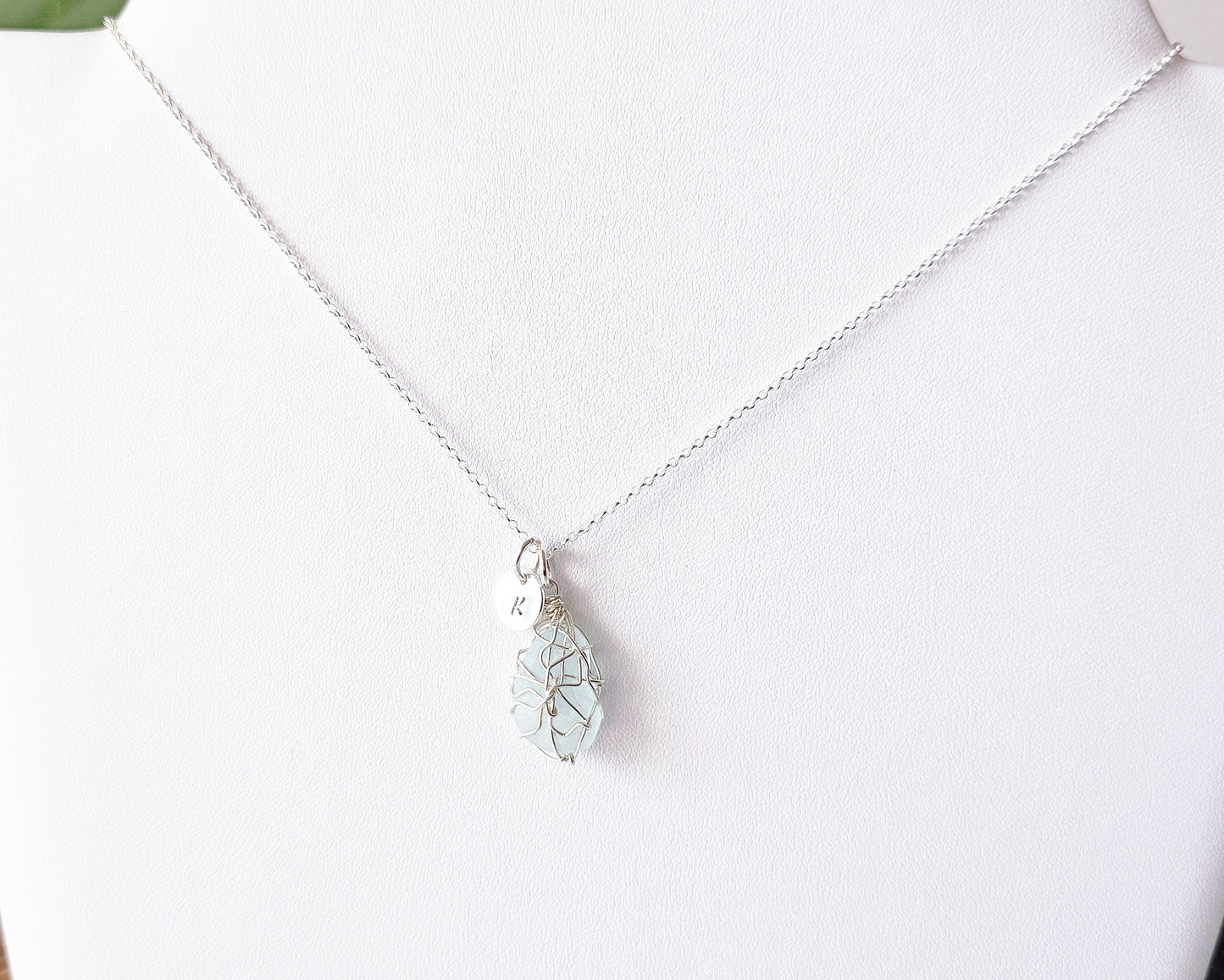 Aqua Blue Sea Glass, Freshwater Sea Glass Wire Wrapped Pendant Necklace with Initial Pendant on Sterling Silver Rolo Chain on white background
