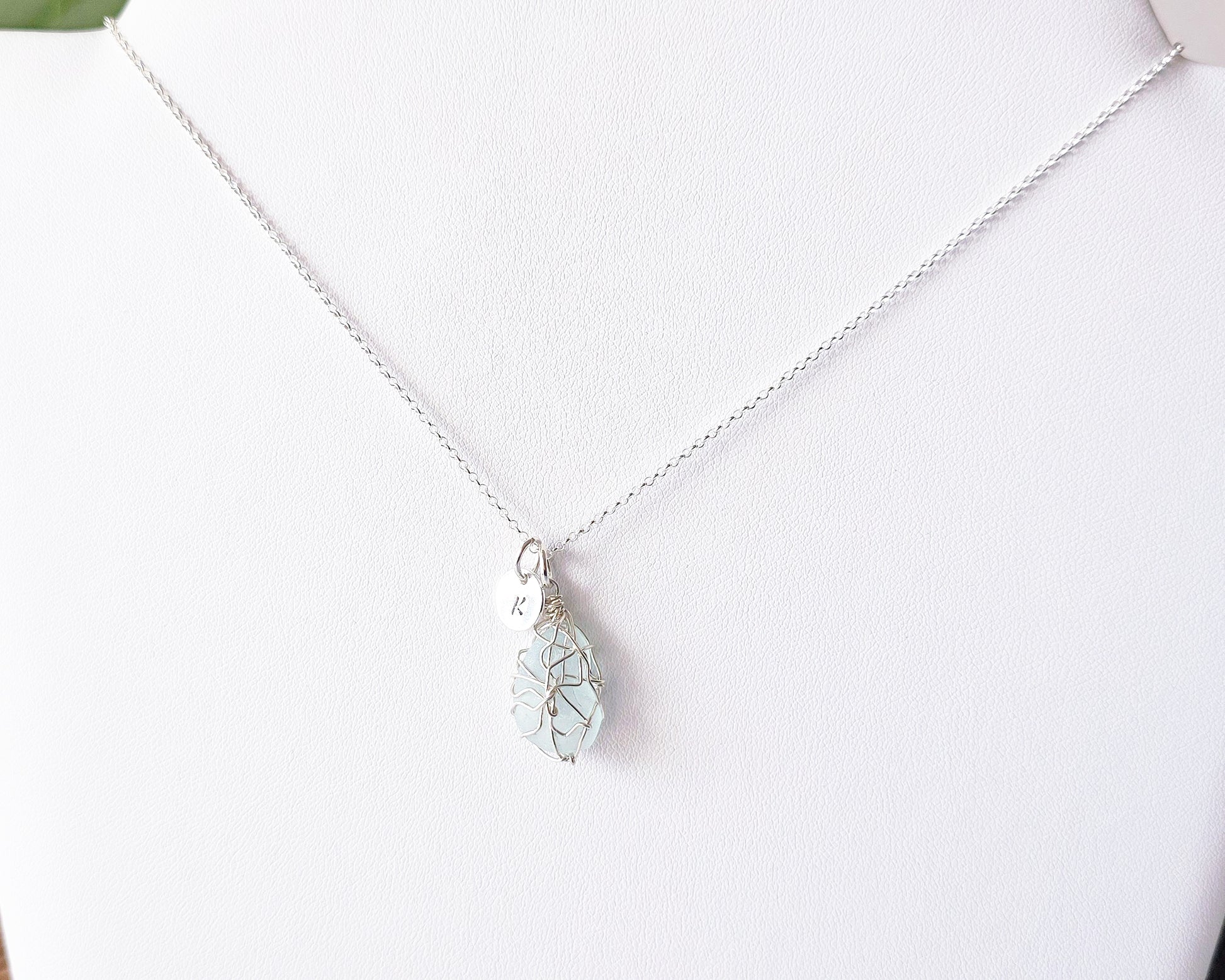 Aqua Blue Sea Glass, Freshwater Sea Glass Wire Wrapped Pendant Necklace with Initial Pendant on Sterling Silver Rolo Chain on white background