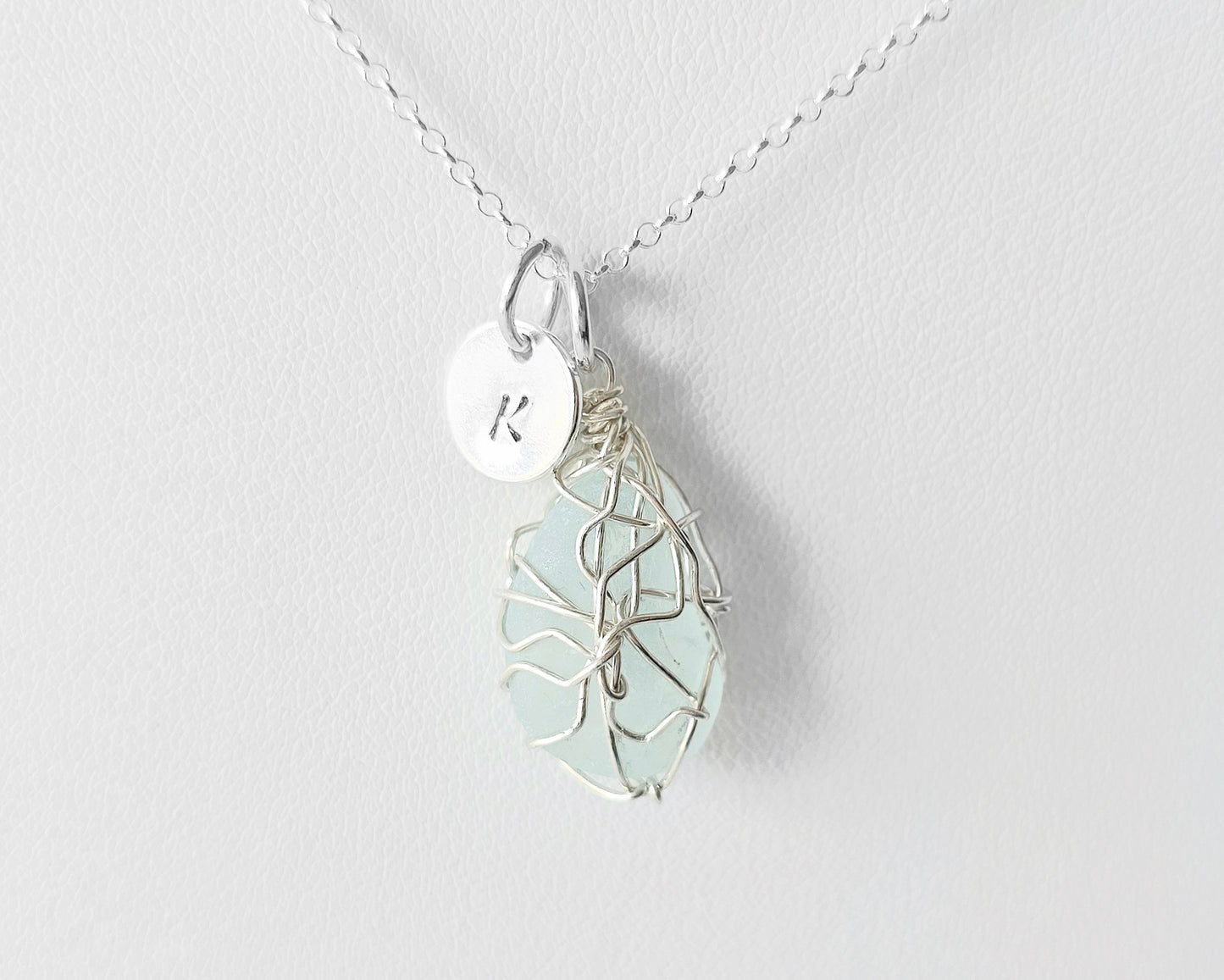 Aqua Blue Sea Glass, Freshwater Sea Glass Wire Wrapped Pendant Necklace with Initial Pendant on Sterling Silver Rolo Chain on white background