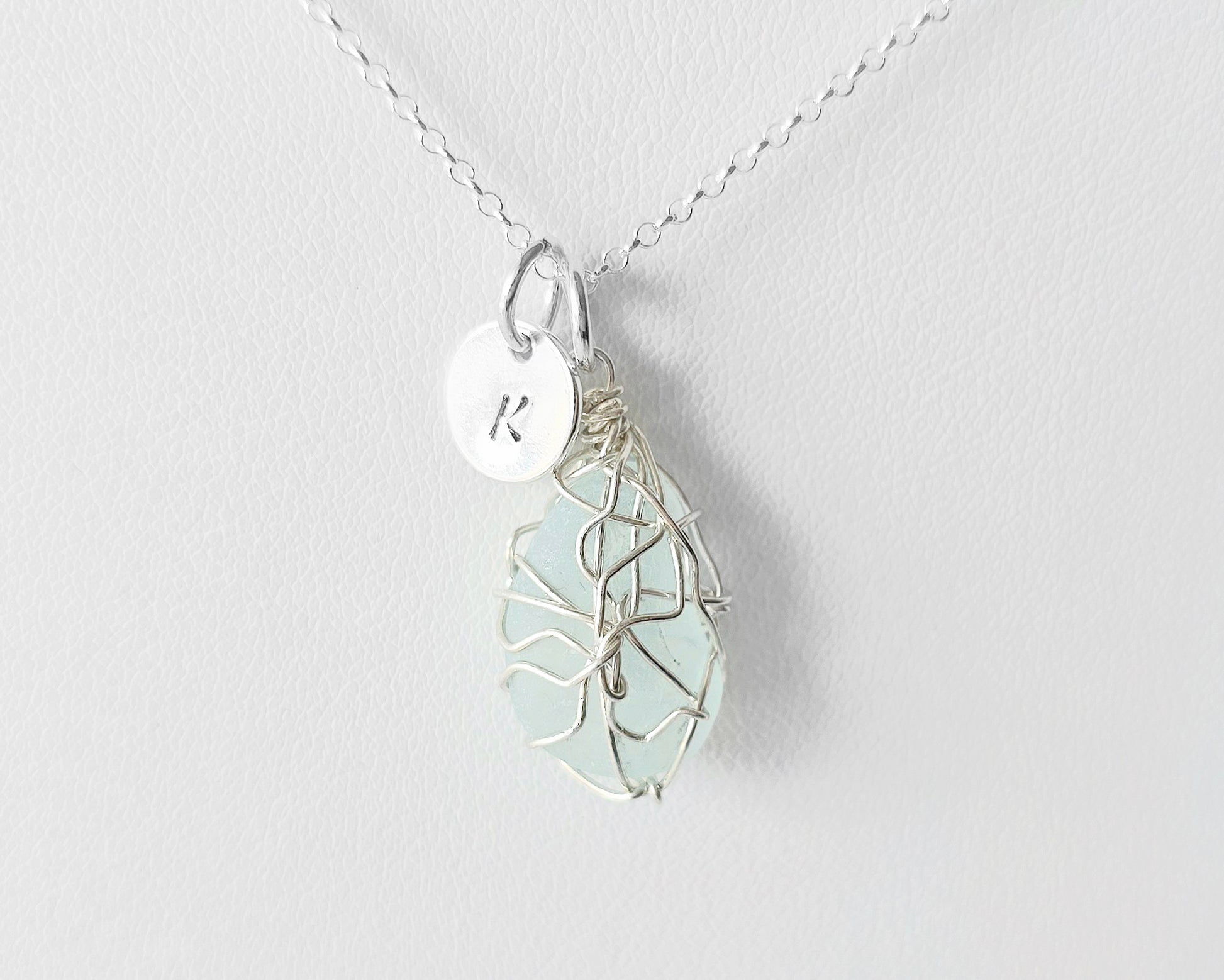 Aqua Blue Sea Glass, Freshwater Sea Glass Wire Wrapped Pendant Necklace with Initial Pendant on Sterling Silver Rolo Chain on white background