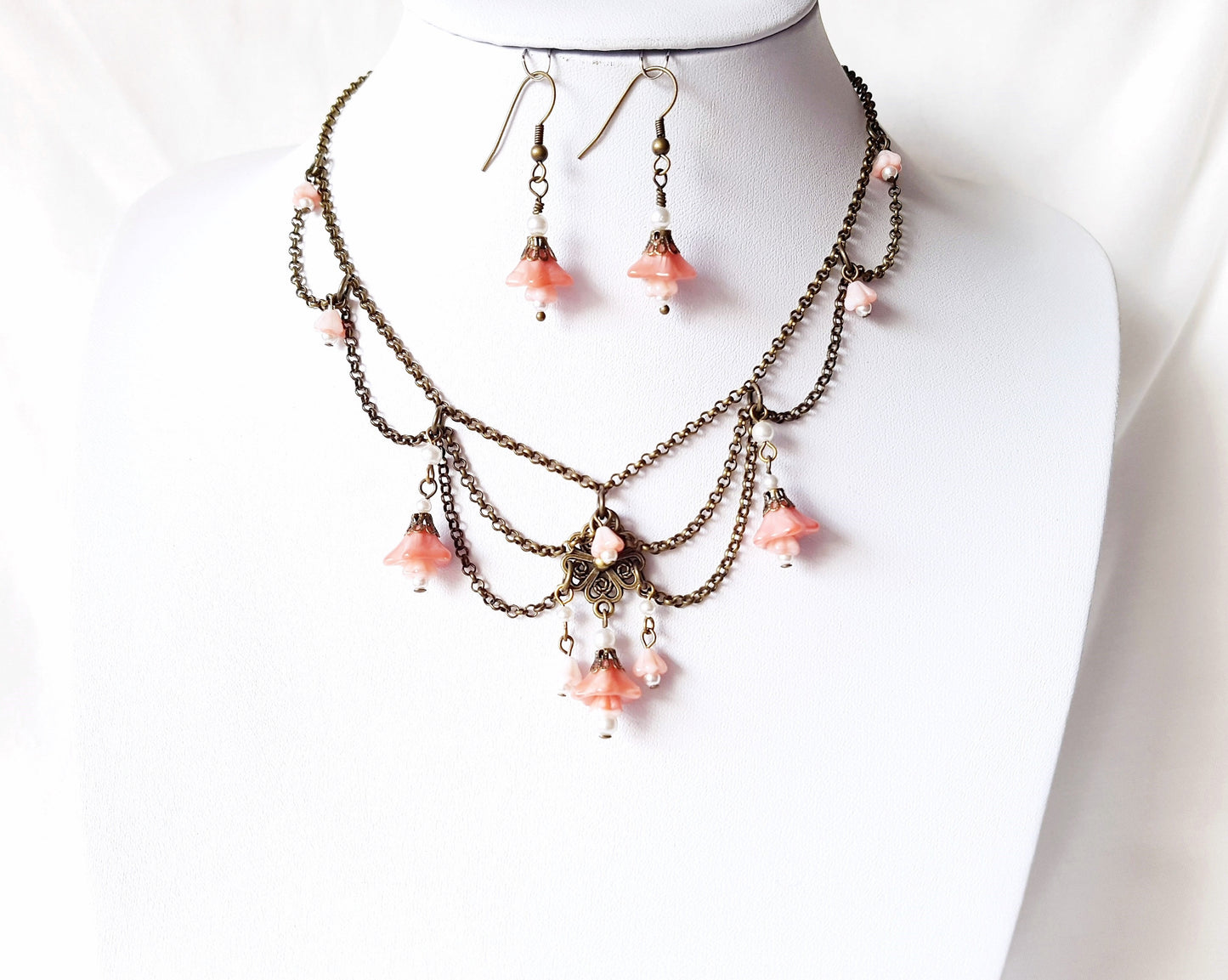 Victorian Style Rose Pink Flower Festoon Necklace and Earring Set with peach pink flower dangles and swags of antiqued brass chain.