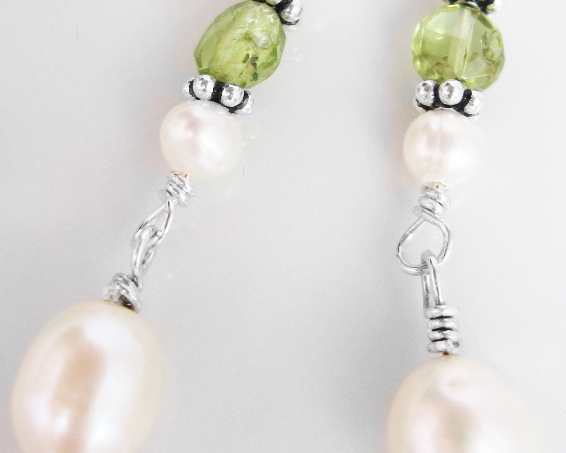 Long Peridot & Freshwater Cultured Pearl Dangle Earrings with Sterling Silver beads displayed on white background 