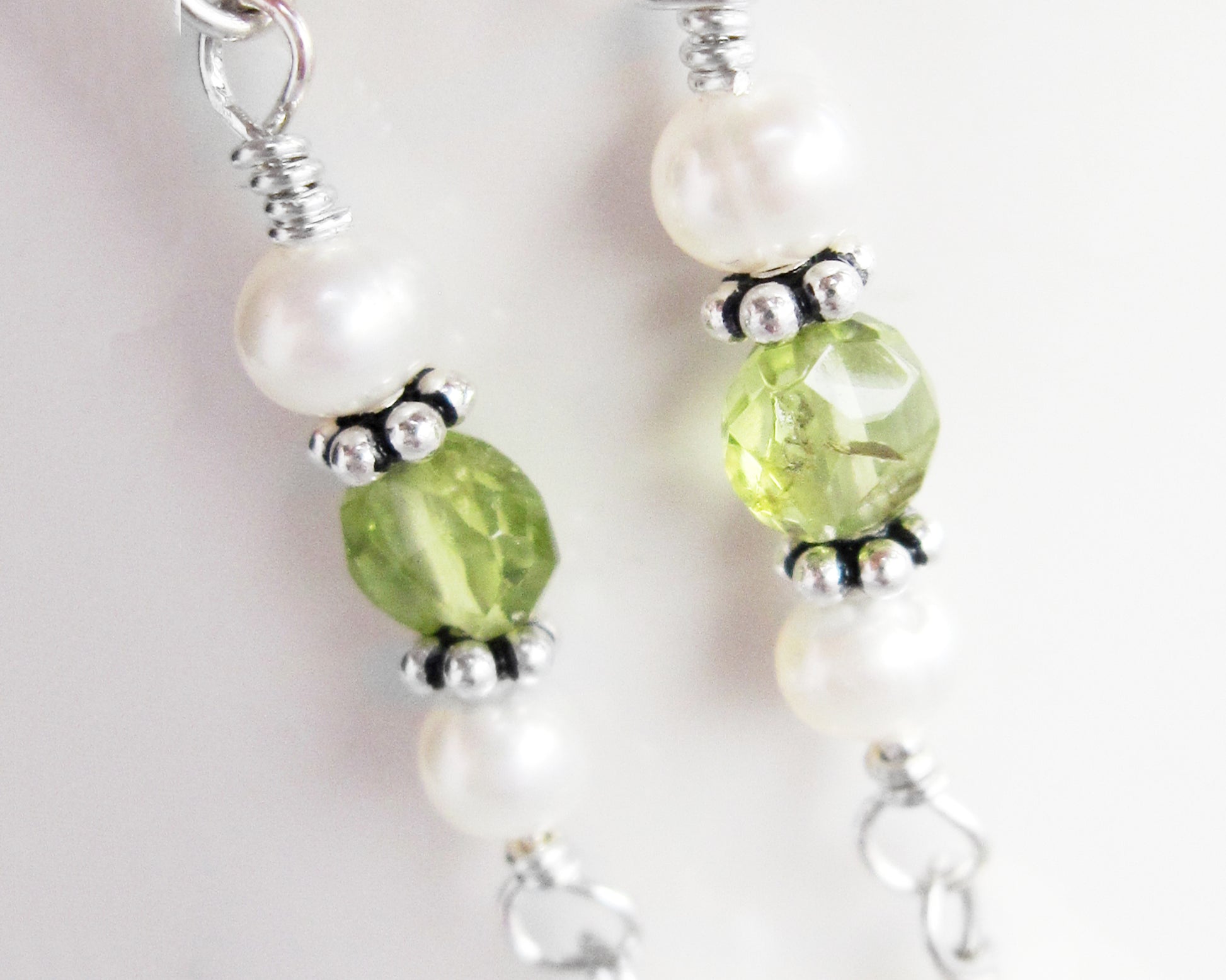 Long Peridot & Freshwater Cultured Pearl Dangle Earrings with Sterling Silver beads displayed on white background 