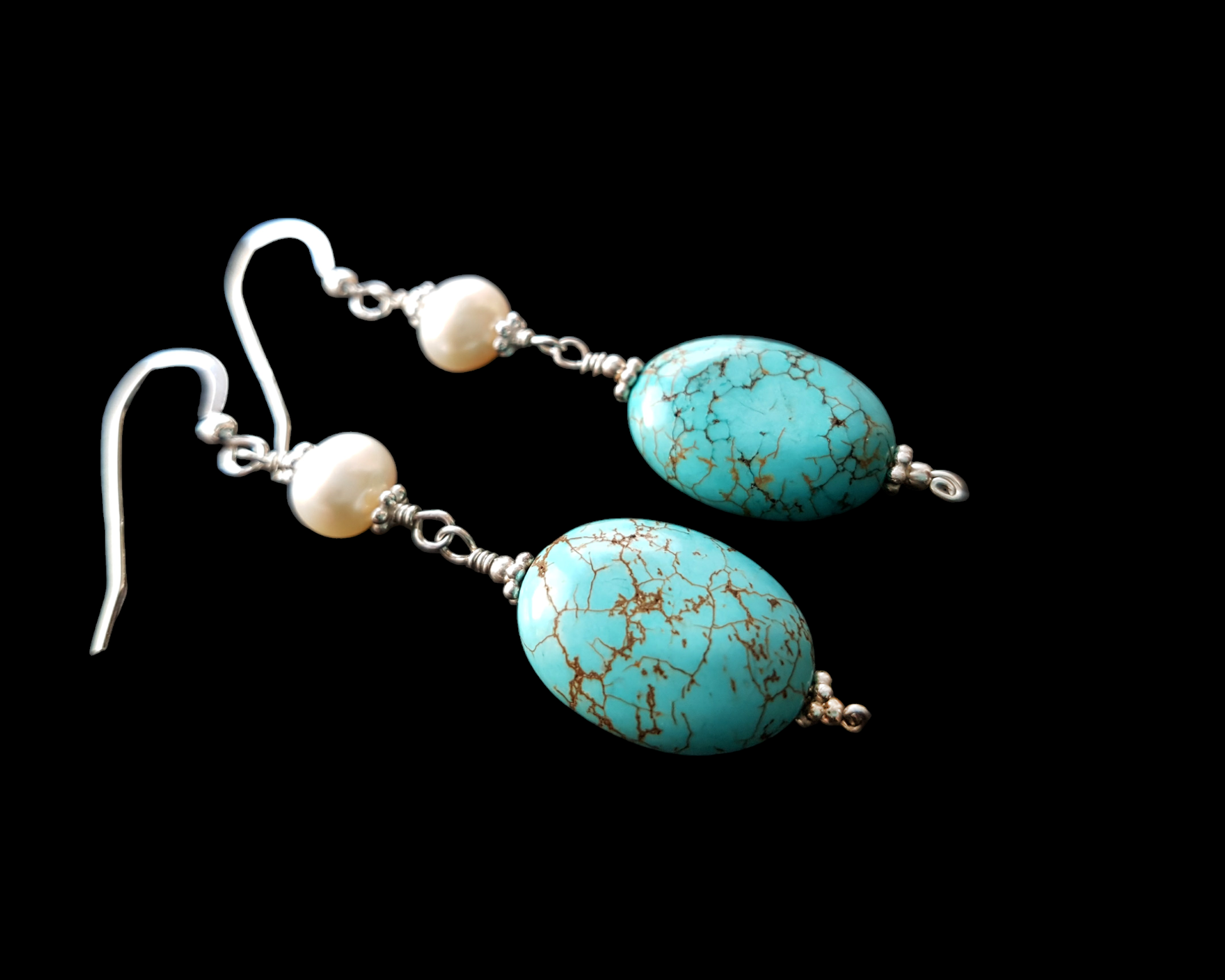 Long Art Deco Style Turquoise Pearl Dangle Earrings with Oval shaped Turquoise stone and round white pearls above, french style earring hooks on black background