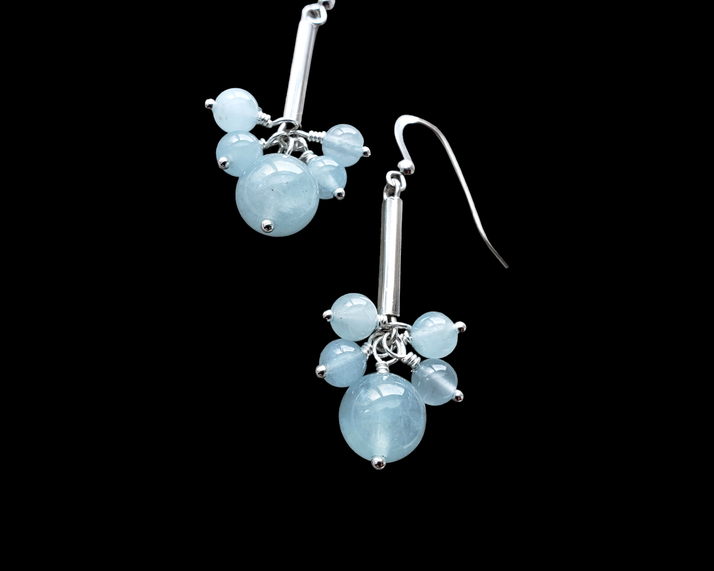 Long Dangly Aquamarine Earrings with five Aquamarine stones dangling from a long Sterling Silver tube. 