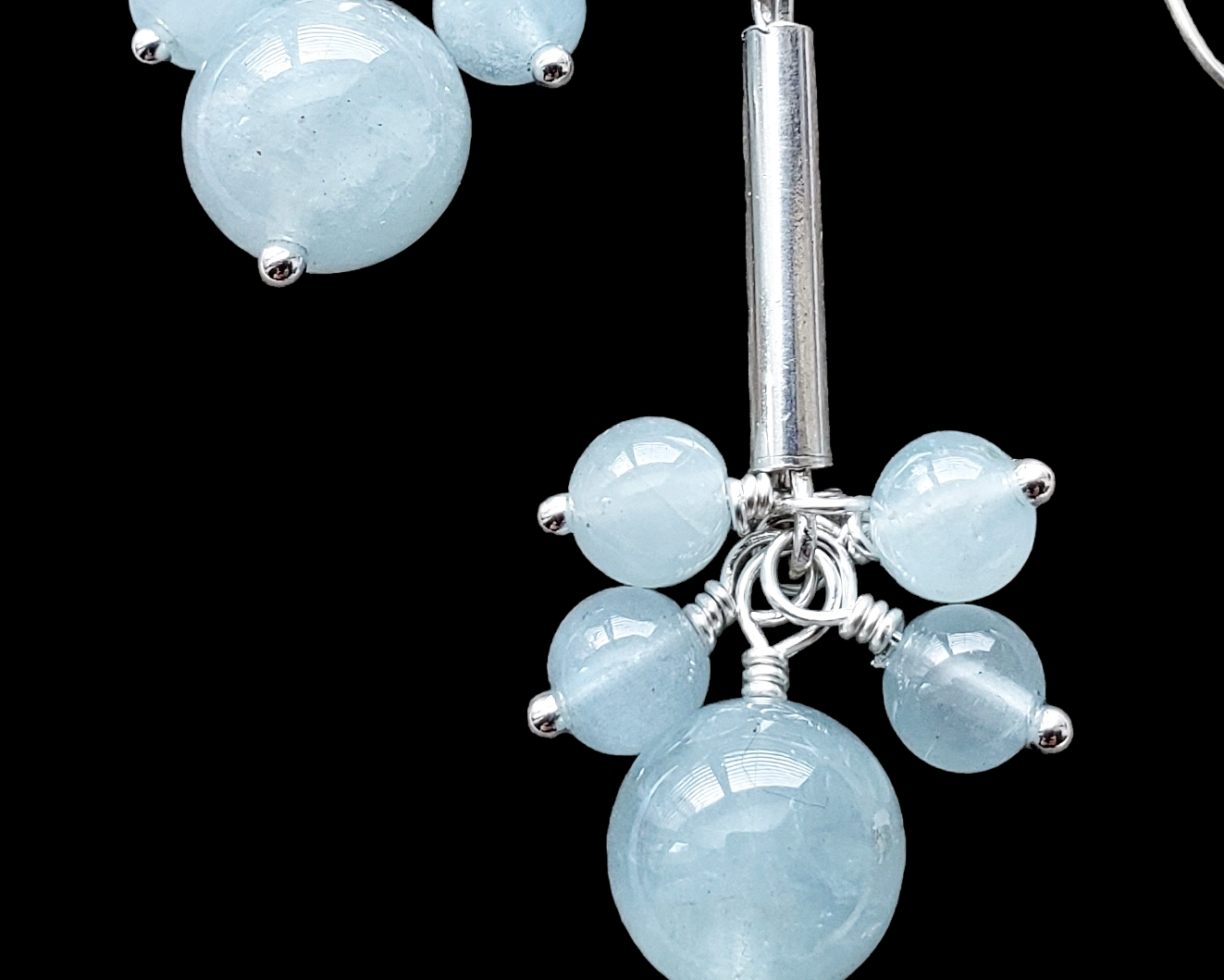 Long Dangly Aquamarine Earrings with five Aquamarine stones dangling from a long Sterling Silver tube. 