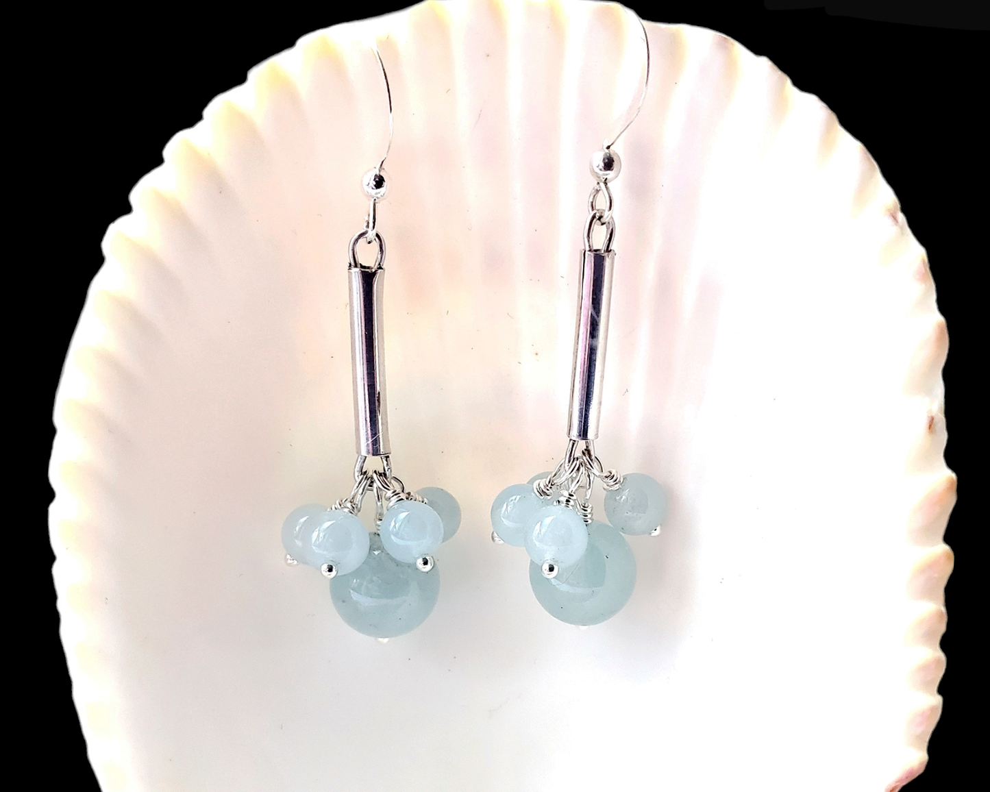 Long Dangly Aquamarine Earrings with five Aquamarine stones dangling from a long Sterling Silver tube. 