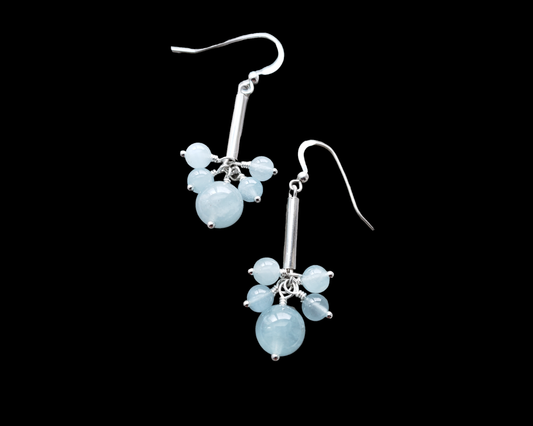 Long Dangly Aquamarine Earrings with five Aquamarine stones dangling from a long Sterling Silver tube. 