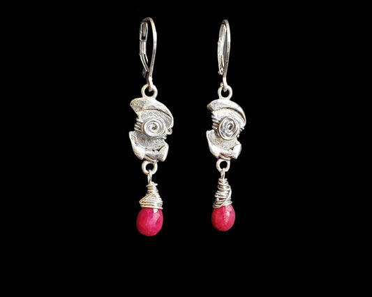 Celtic Style Ruby and Sterling Silver Long Dangle Earrings with Celtic Desing and Drop shaped faceted Ruby stones. 