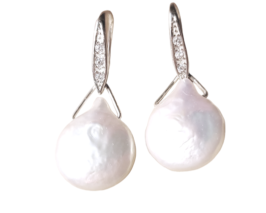 Large White Baroque Pearl Earrings, Large white, drop shaped, almost coin shaped pearls danglin from a Cubic Zirconia encrusted french earrings hooks.