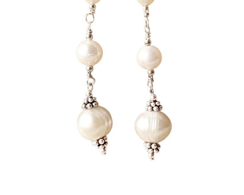 Long art deco style pearl earrings, white Freshwater Cultured Pearls, accented with fancy Sterling Silver beads on white background
